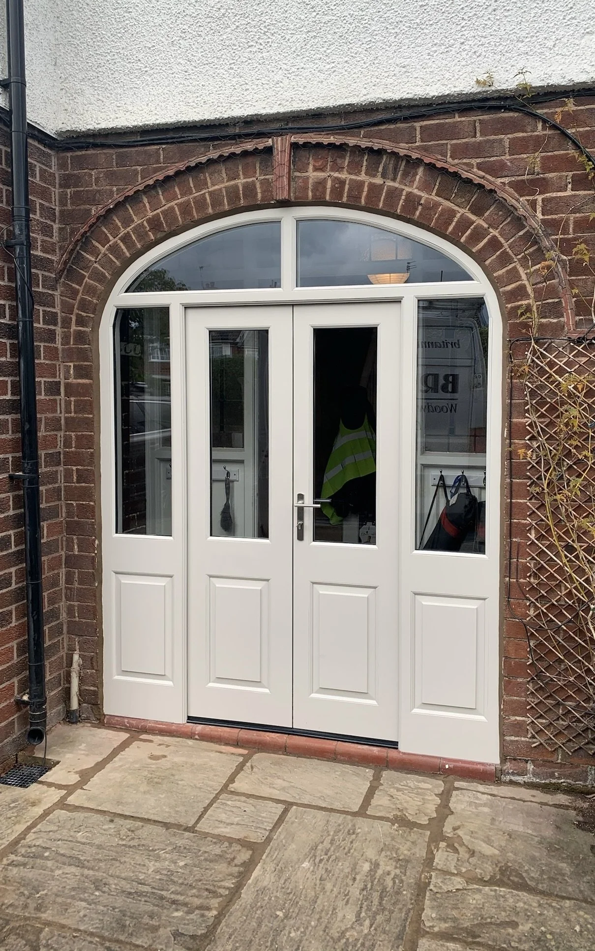 Cream double doors, arched frame