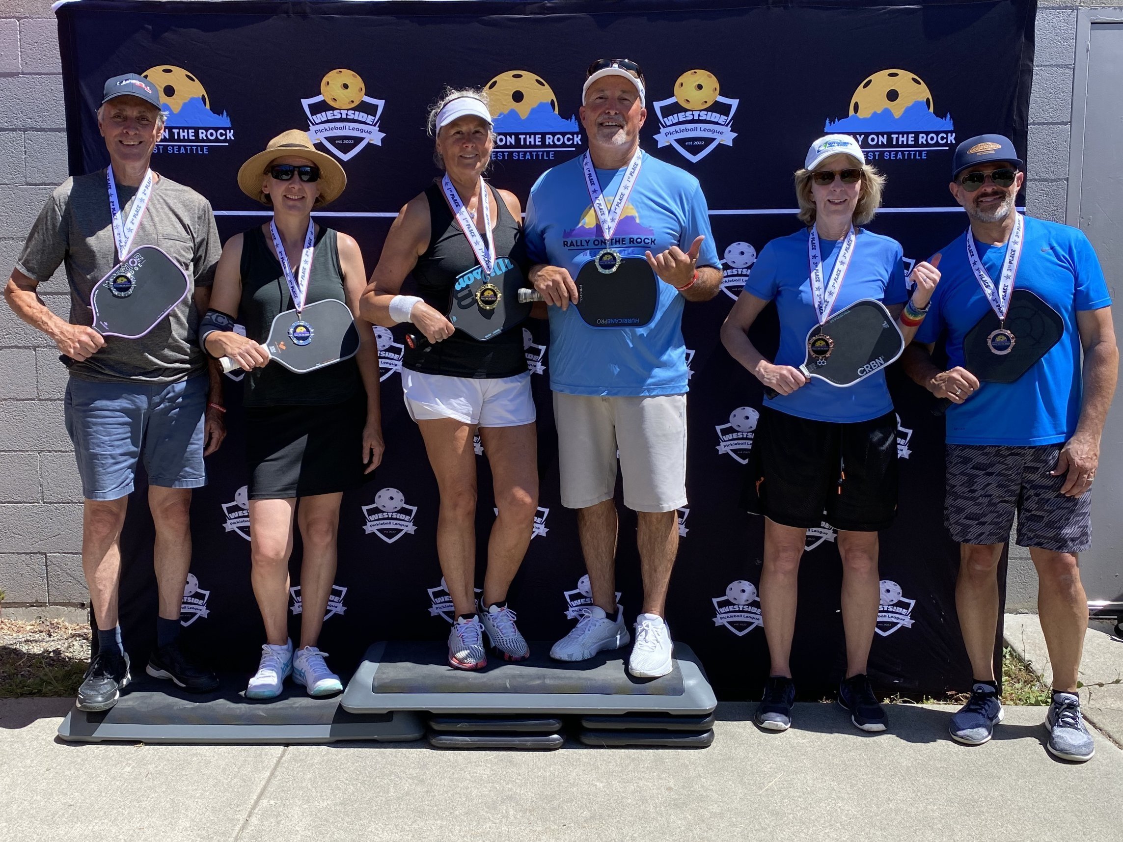 RALLY ON THE ROCK JUNE 2025:  Mixed Doubles, 3.0, 50+ (l-r)   ~   SILVER: Paul Vandegrift & Karen Castelain.   ~   GOLD: Kathleen Goulet & Don Goulet.   ~   BRONZE: Kim Mathey & John Marino.