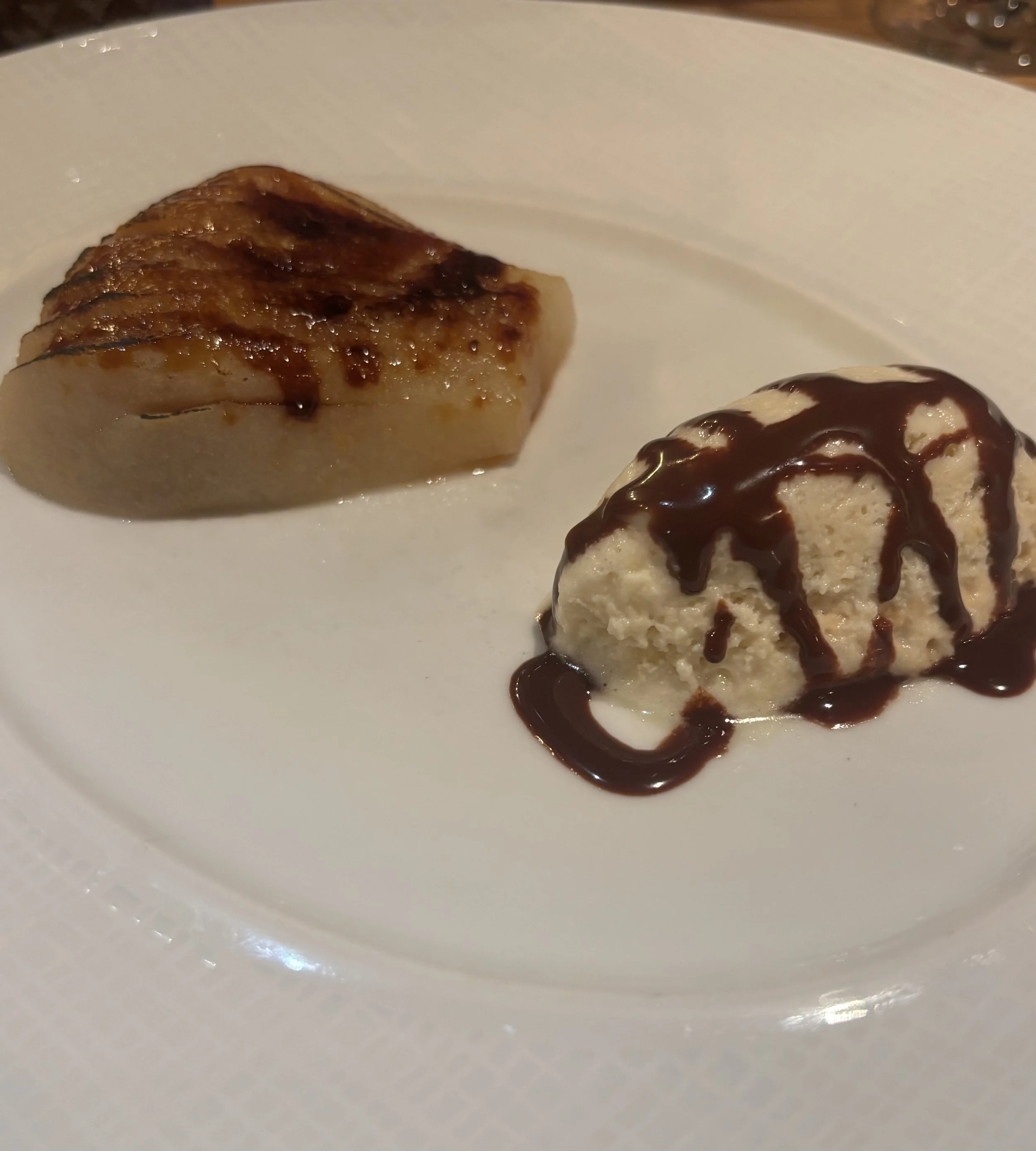 poached pear, light chocolate caramel, pear sorbet with Jamaican pepper”.