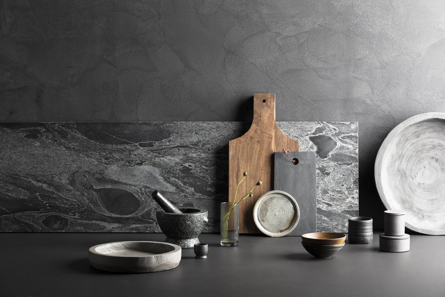 CONTRIBUTE - Created around the ethos of products that contribute to wellbeing, Dark and earthy, with shade of stone.