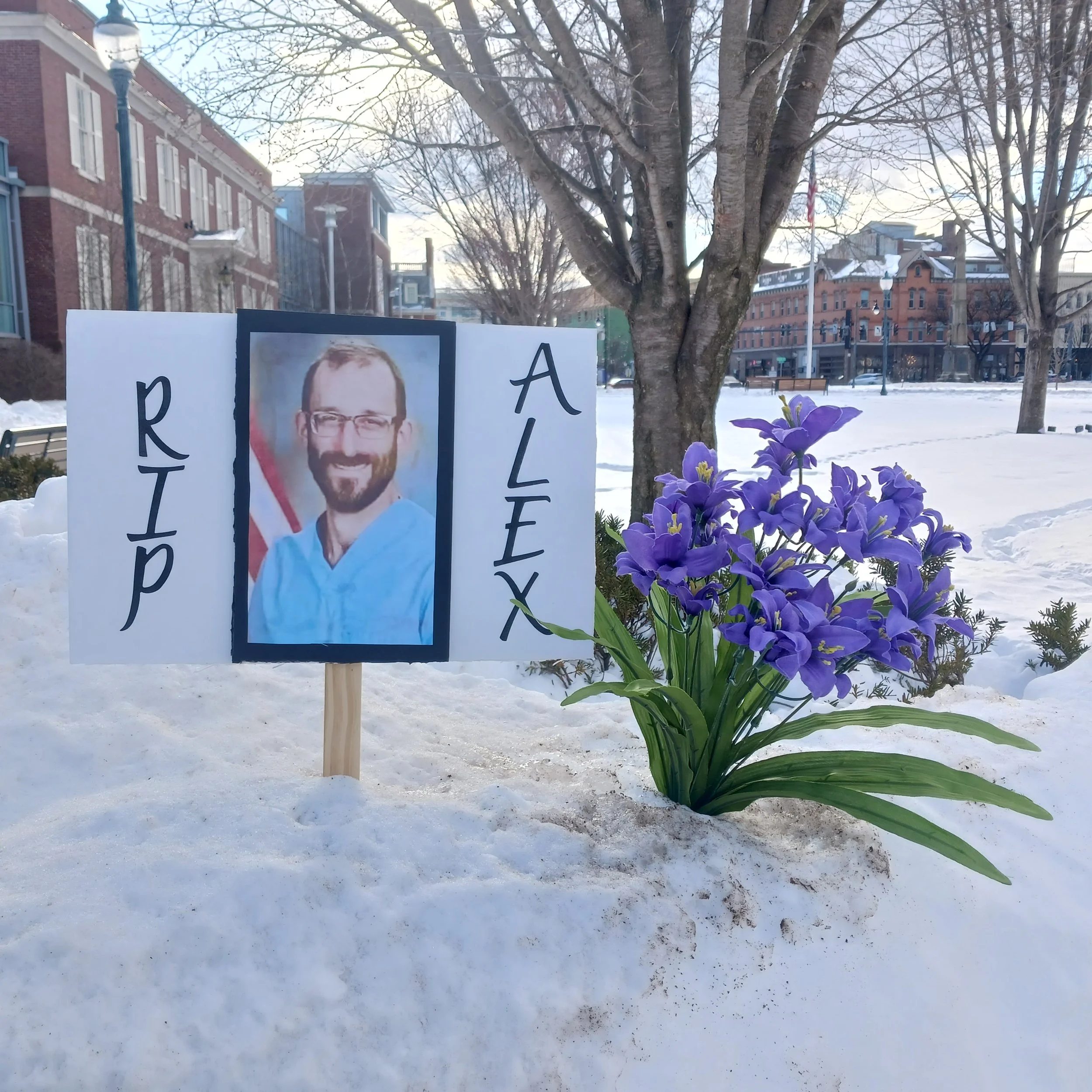 Image:  A photo of Alex Pretti was left behind at the site of a vigil held in upstate New York.