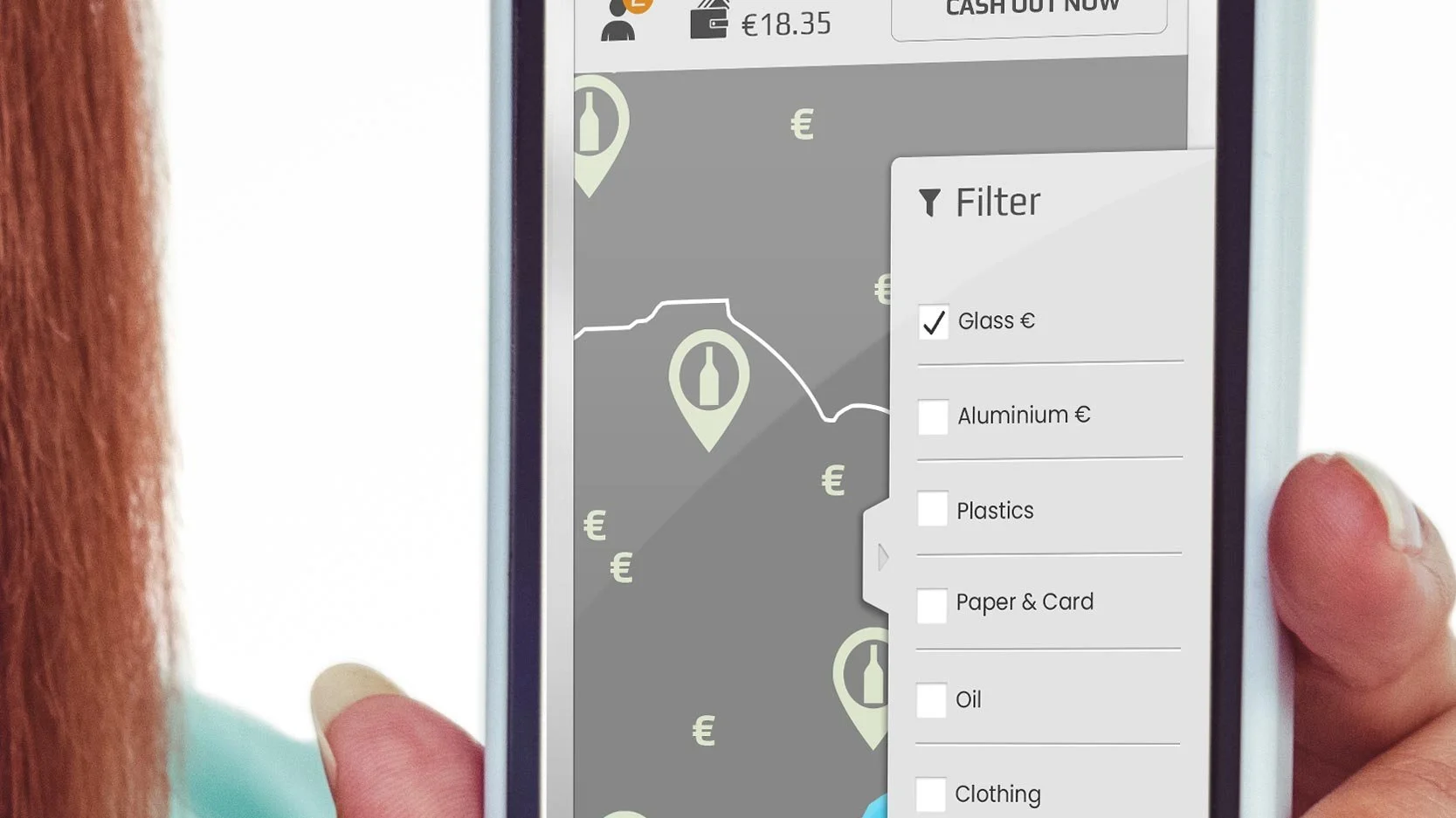 A person holding a smartphone displaying a recycling or waste management app. The app shows a map with container locations marked with bottle icons and a filter menu highlighting "Glass €" with other options like aluminum, plastics, paper & card, oil, and clothing.