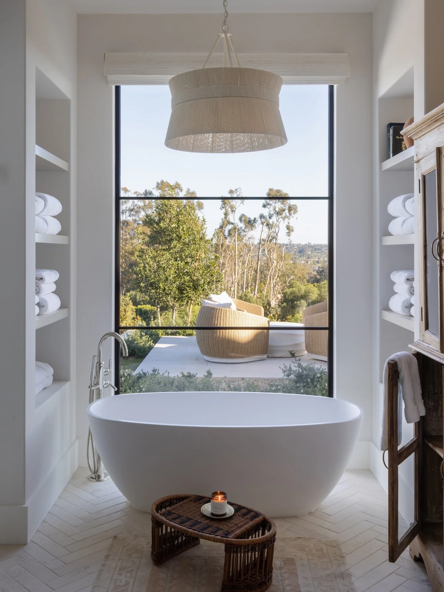 A sun-filled bathroom with views as far as the eye can see.