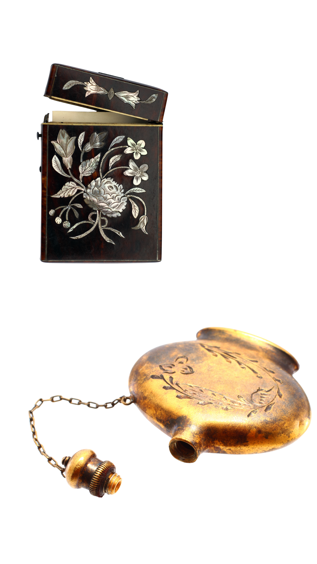 A black jewelry box with a floral design in white and beige, next to a gold heart-shaped locket with floral engravings on a chain.