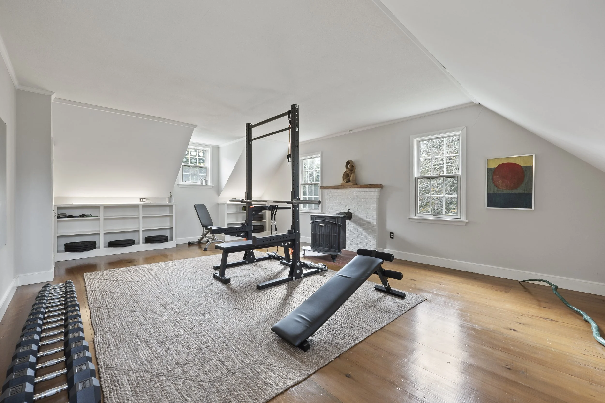We upgraded the 3-story barn to create a dream studio with space, heat, running water, half bath, plenty of natural light and power, height to accommodate all manner of oversize productions. A separate heated woodworking shop is on the lower level.