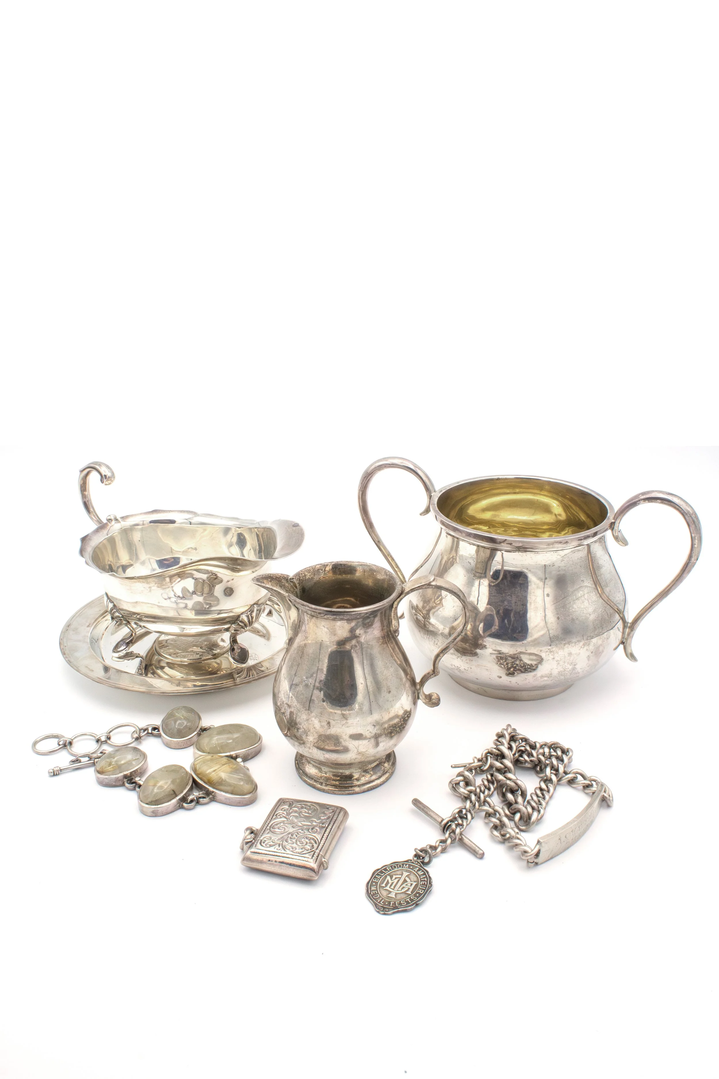 Sell silverware, including teapots, cups, trays, bracelets, chains, and pendants.