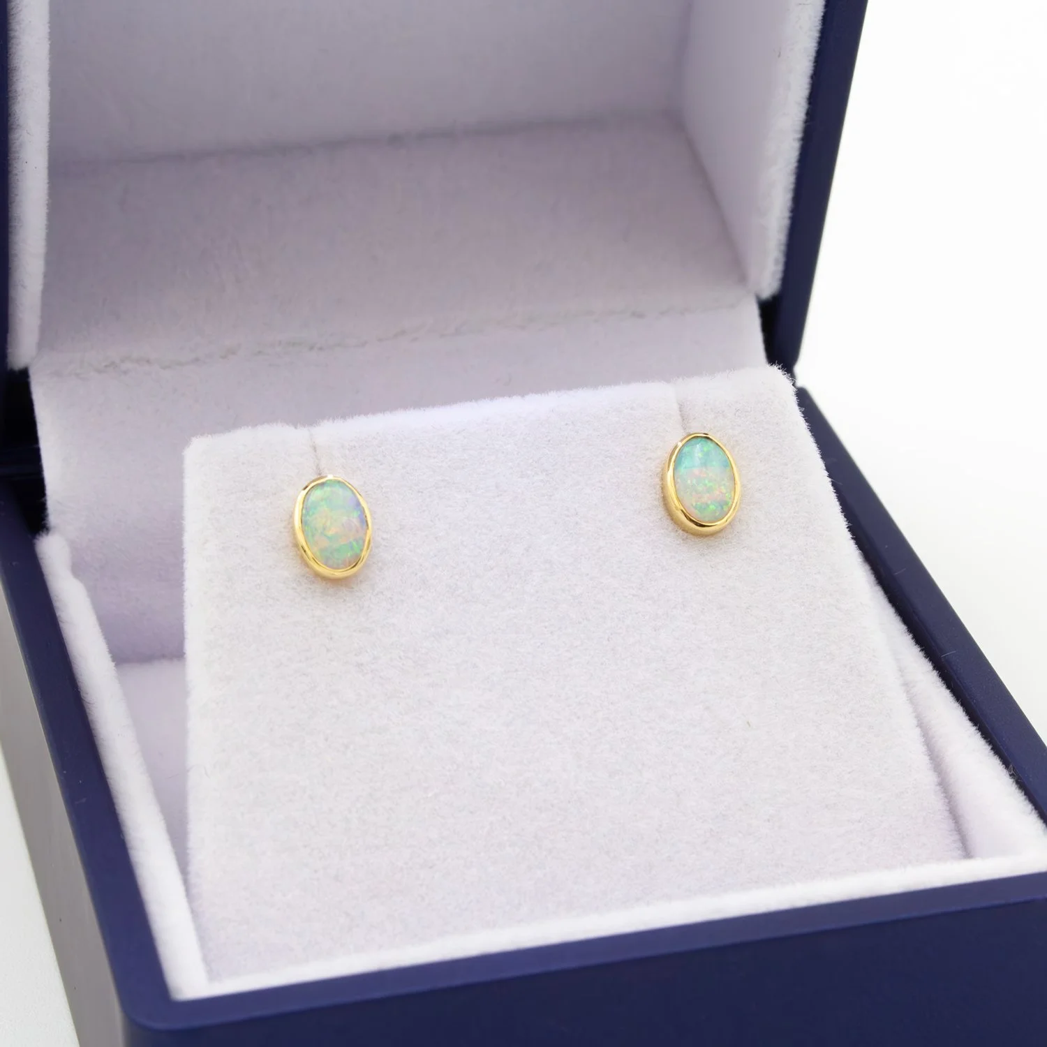 Gold Oval Opal Stud Earrings Jacksons Jewellers.jpg