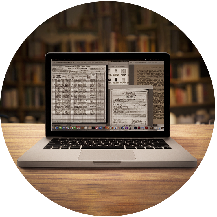 Open laptop on a library table, with screen showing several open windows of online archival documents.