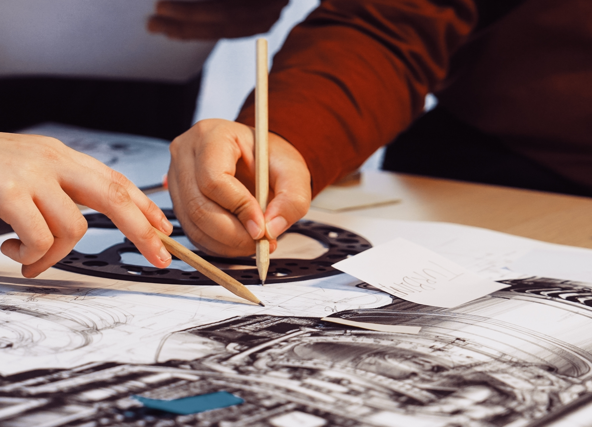 hands pointing to a part blueprint
