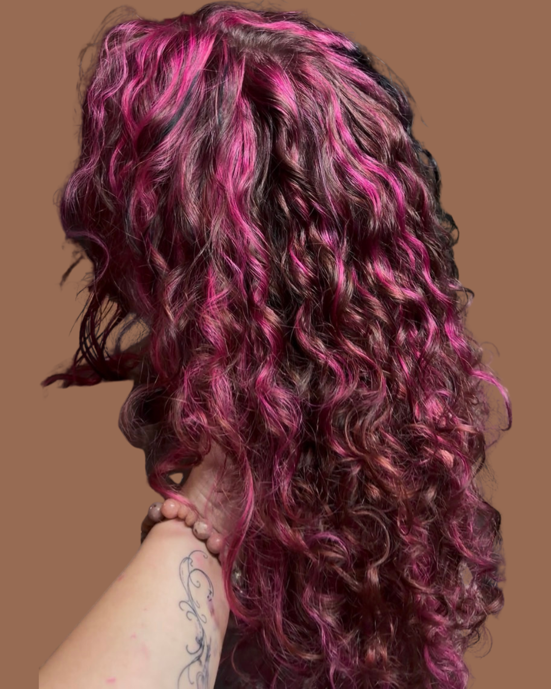 curly pink highlighted hair