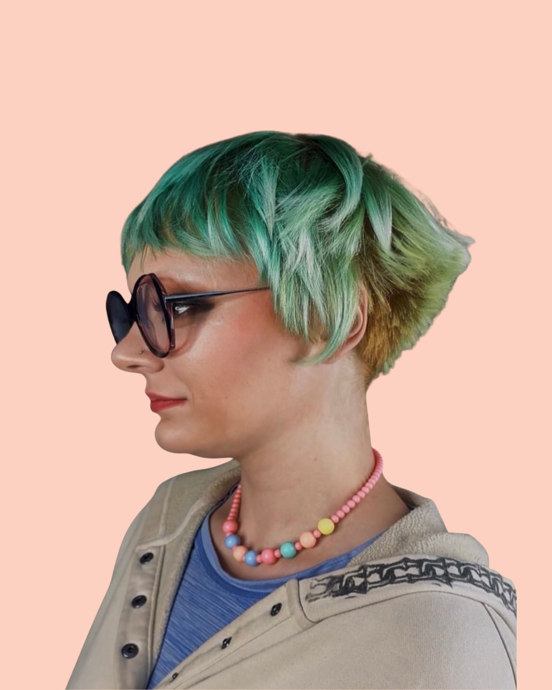 person with short multi-colored hair