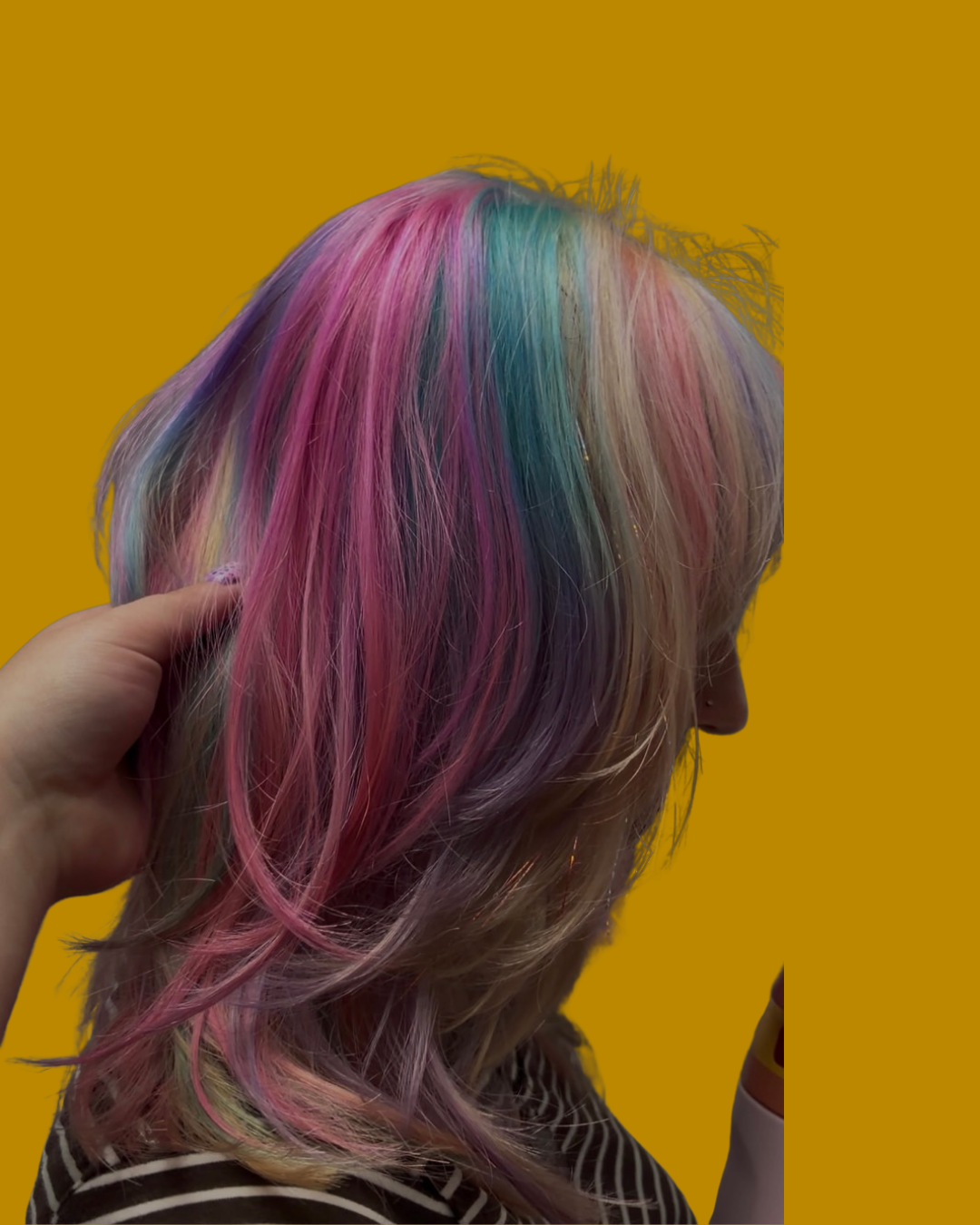 person with blue and pink and blonde highlights