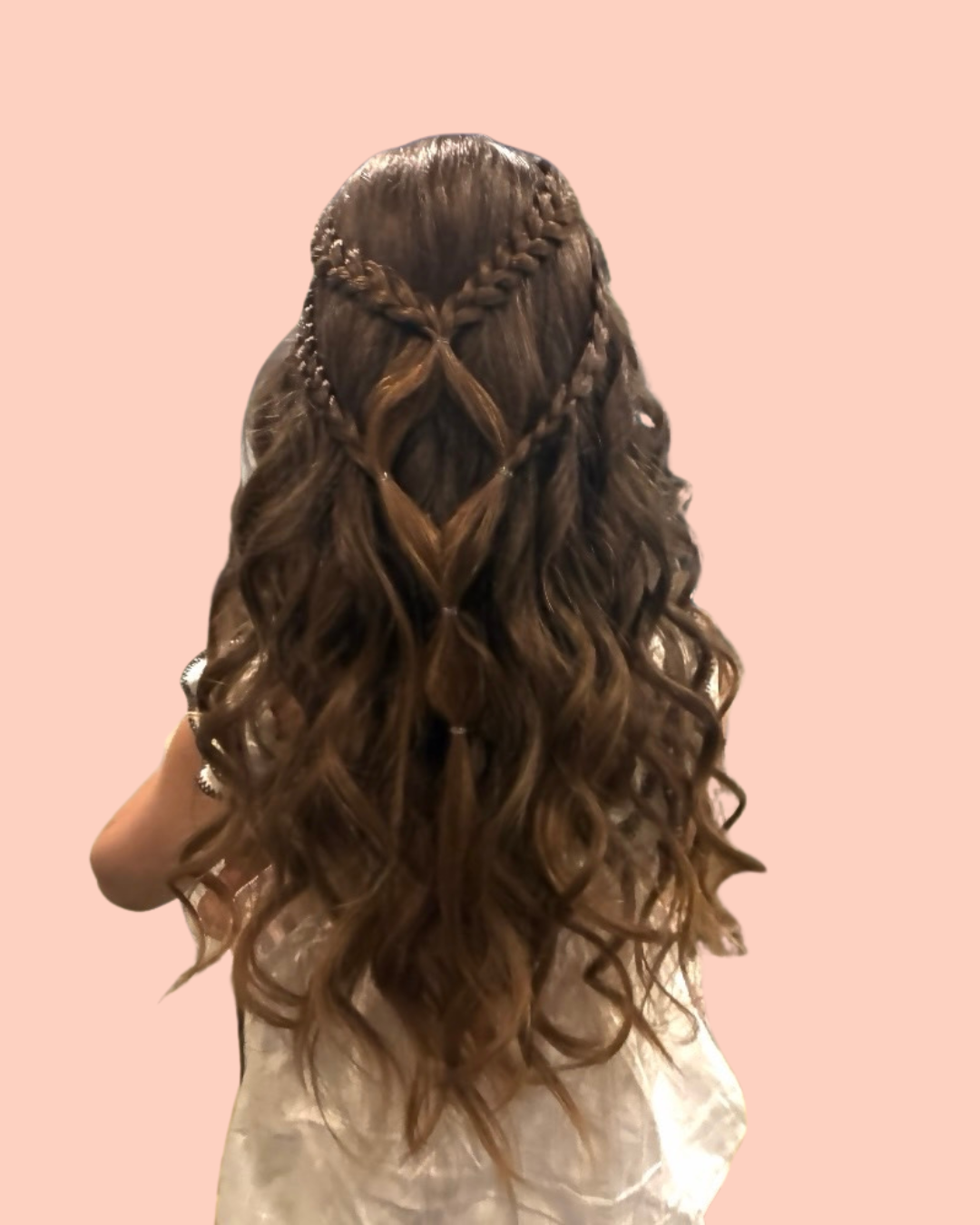 person with braided hair facing away from camera