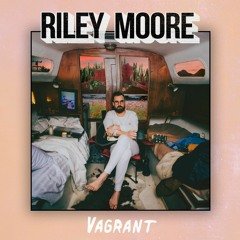 Album cover titled 'Vagrant' by Riley Moore, featuring a man with a beard and glasses sitting in a retro camper interior surrounded by beds and colorful decor.