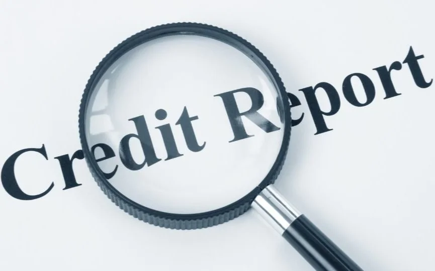 Magnifying glass over the words 'Credit Report'