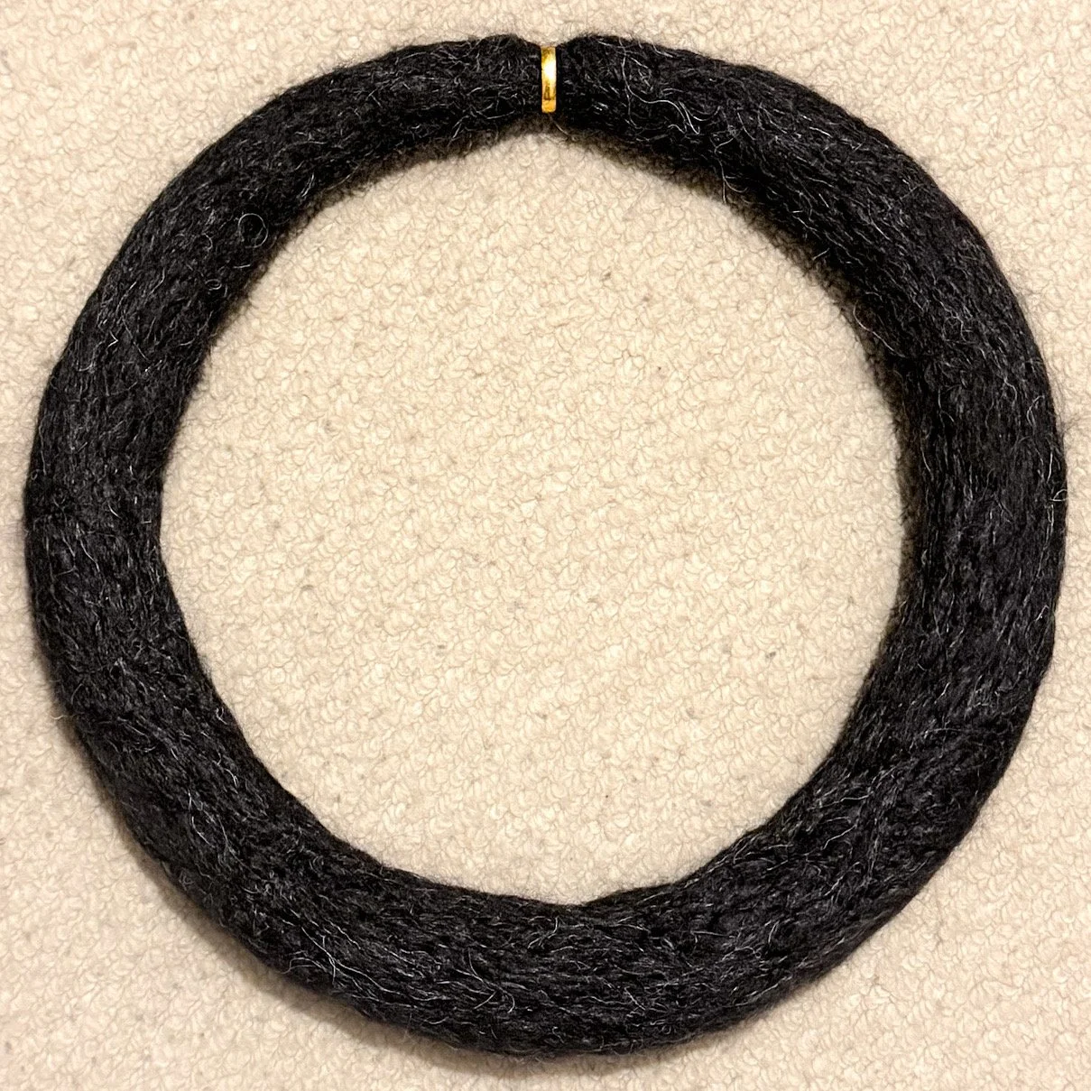 needle felted wool - circular sculpture through a wedding band. created as a cathartic process during divorce