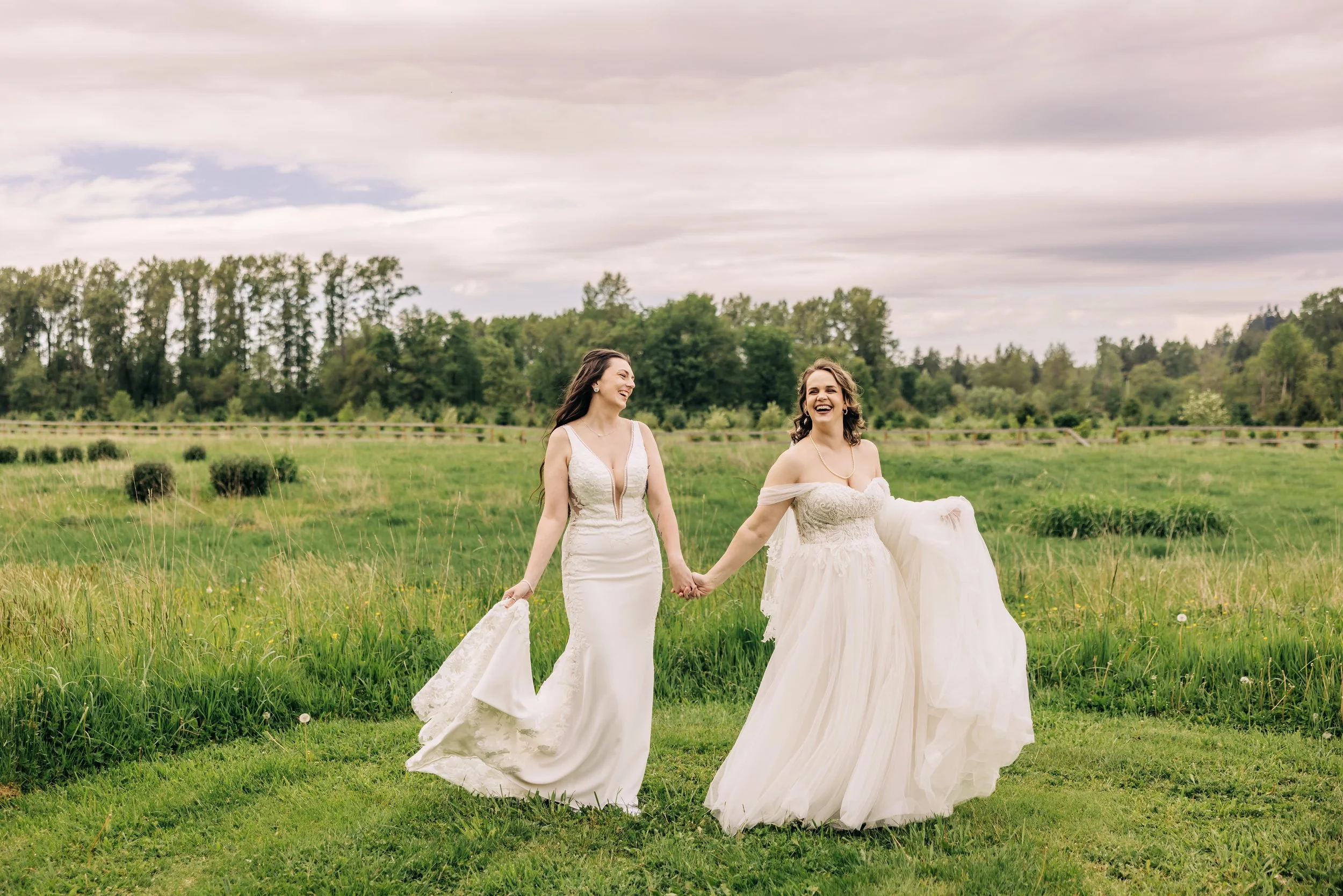 First look of two brides in the pasture at Marionfield Farm in Arlington. 