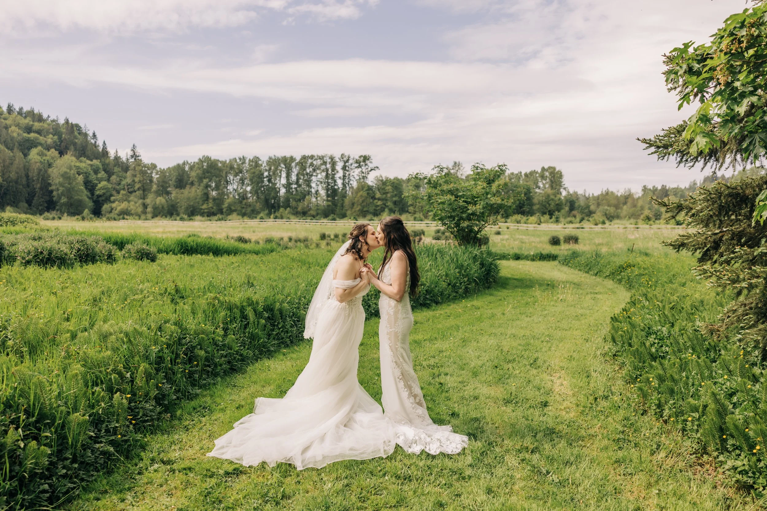Two brides kiss at Marionfield Farm in Arlington. 