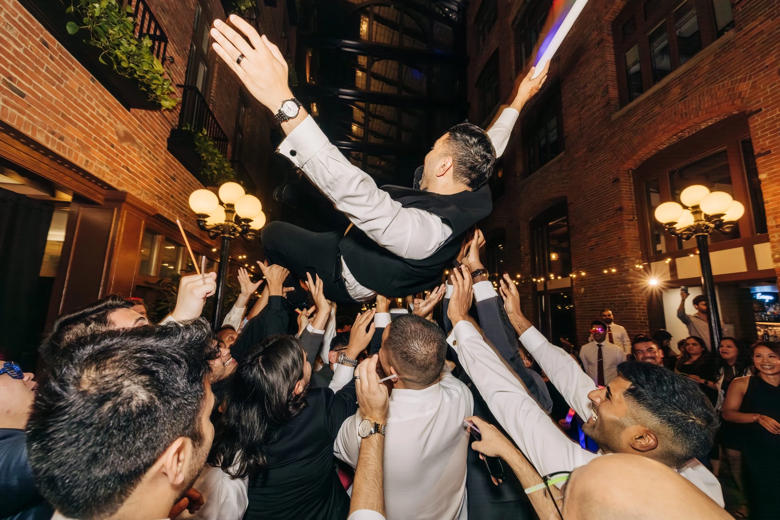 Groom crowd surfing at Court in the Square