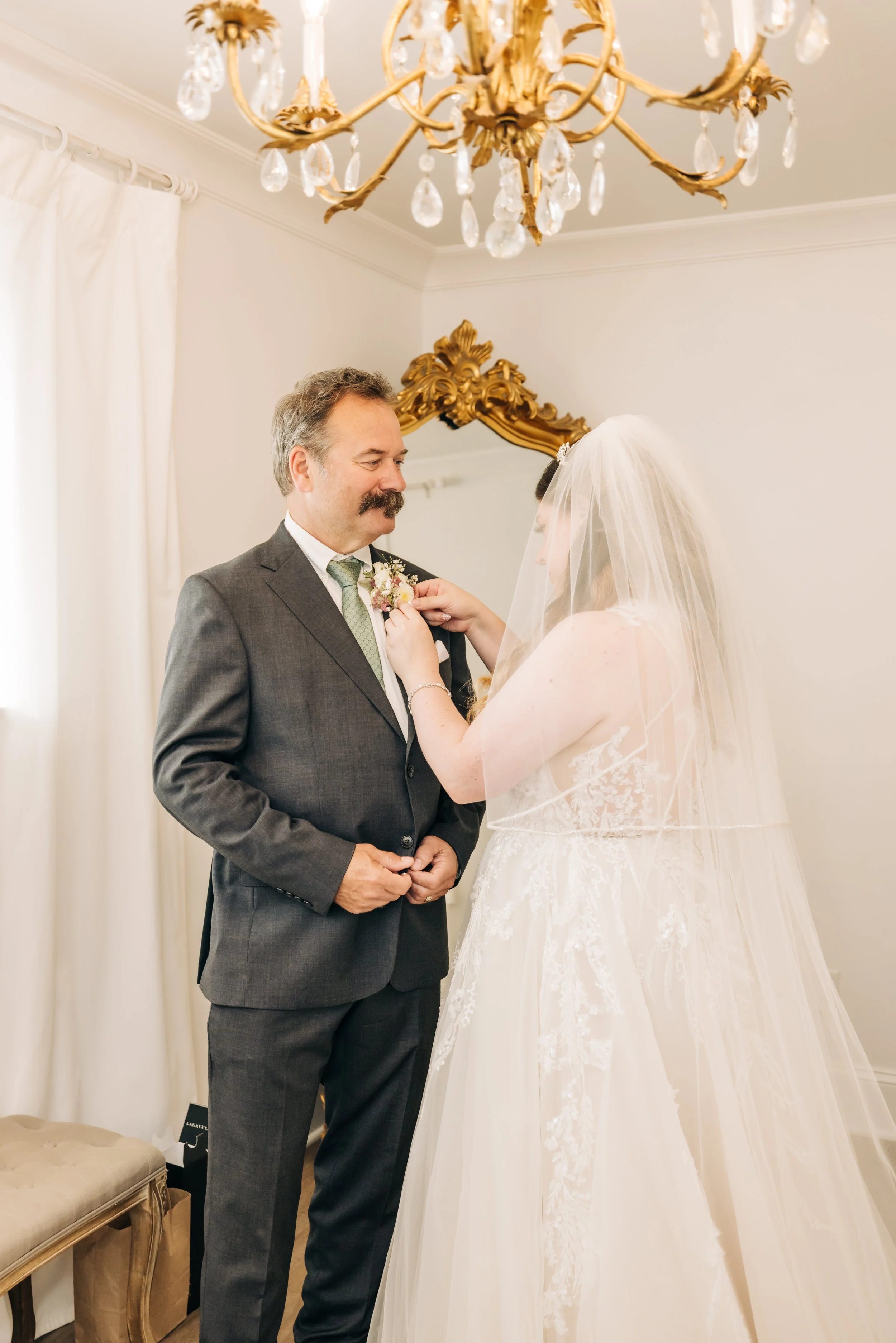Daughter pinning dad boutonnière 