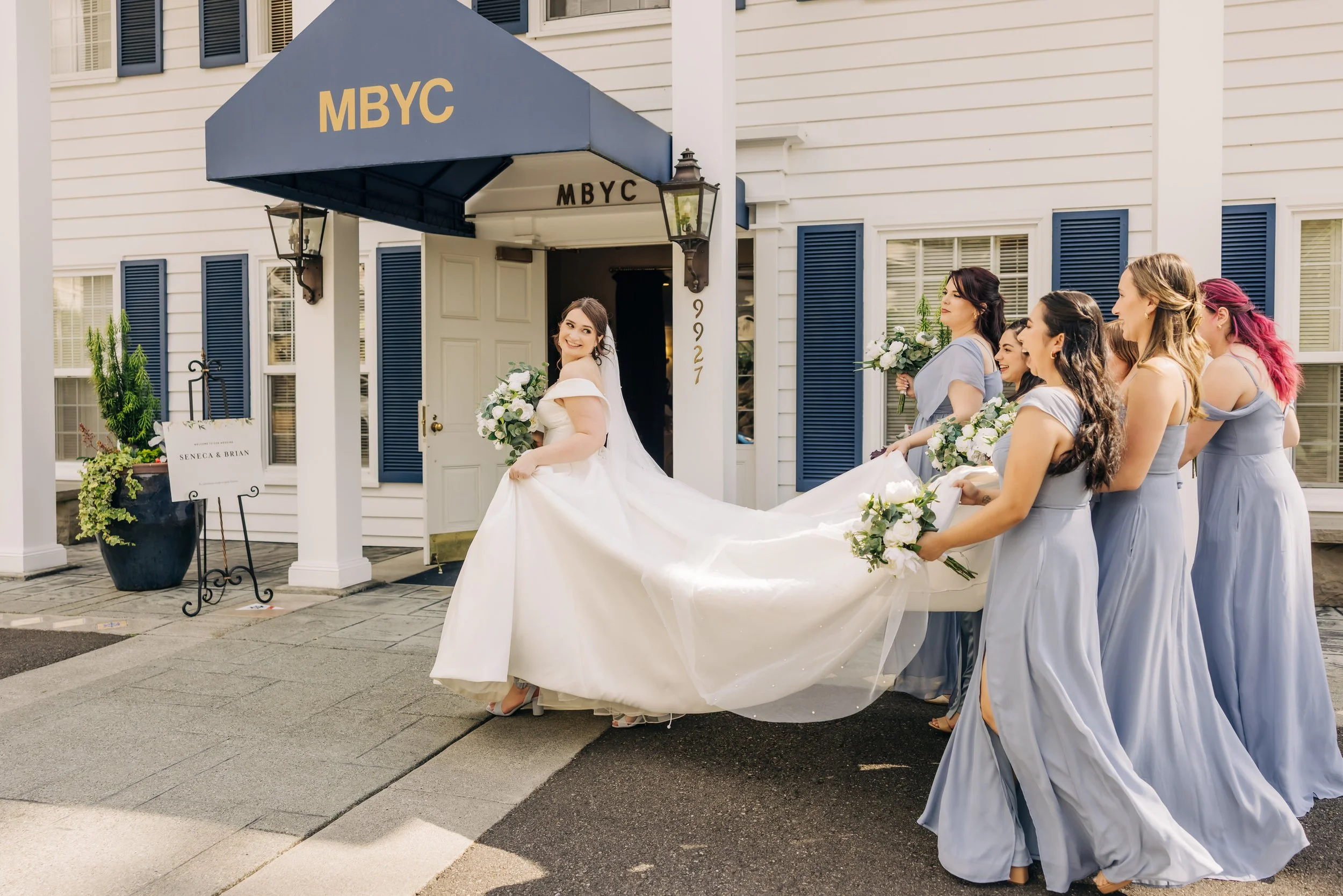 Bridesmaids carrying dress at Meydenbauer Yacht Club