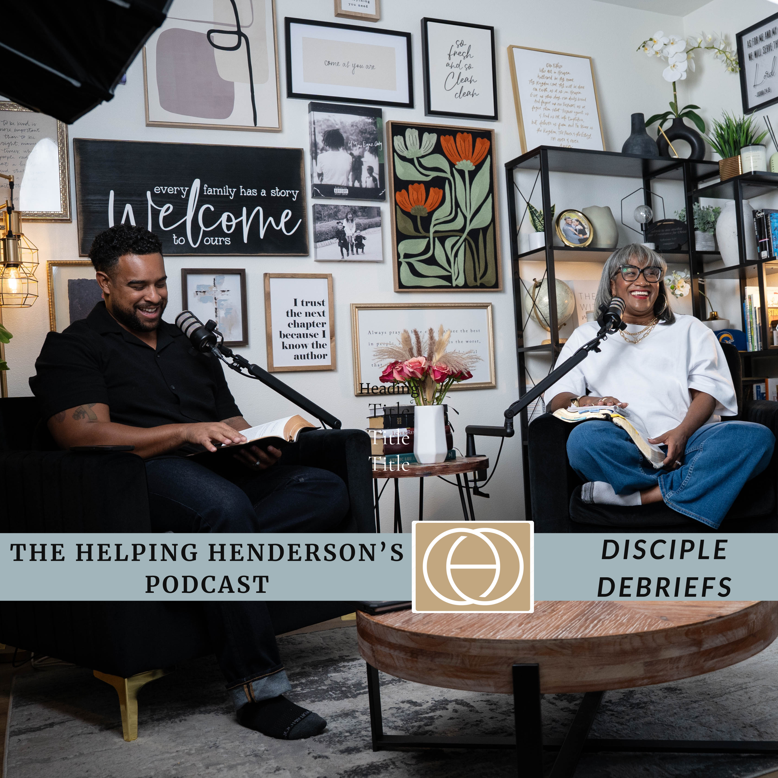 Two people sitting on black sofas, smiling and recording a podcast in a cozy, decorated room. There is a table with a vase of pink flowers and books. The background wall has framed artwork, quotes, and pictures. The podcast logo and title overlay the bottom part of the image.