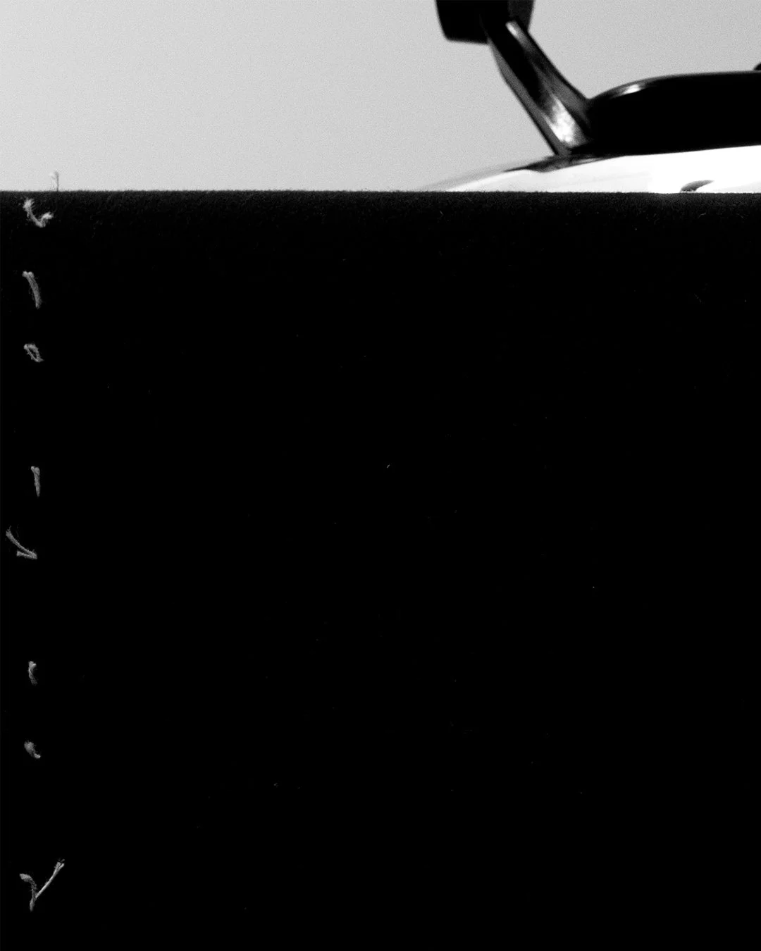 Lafóa Studio - Behind the scenes of a tailoring studio - A photograph of an iron on wool fabric.