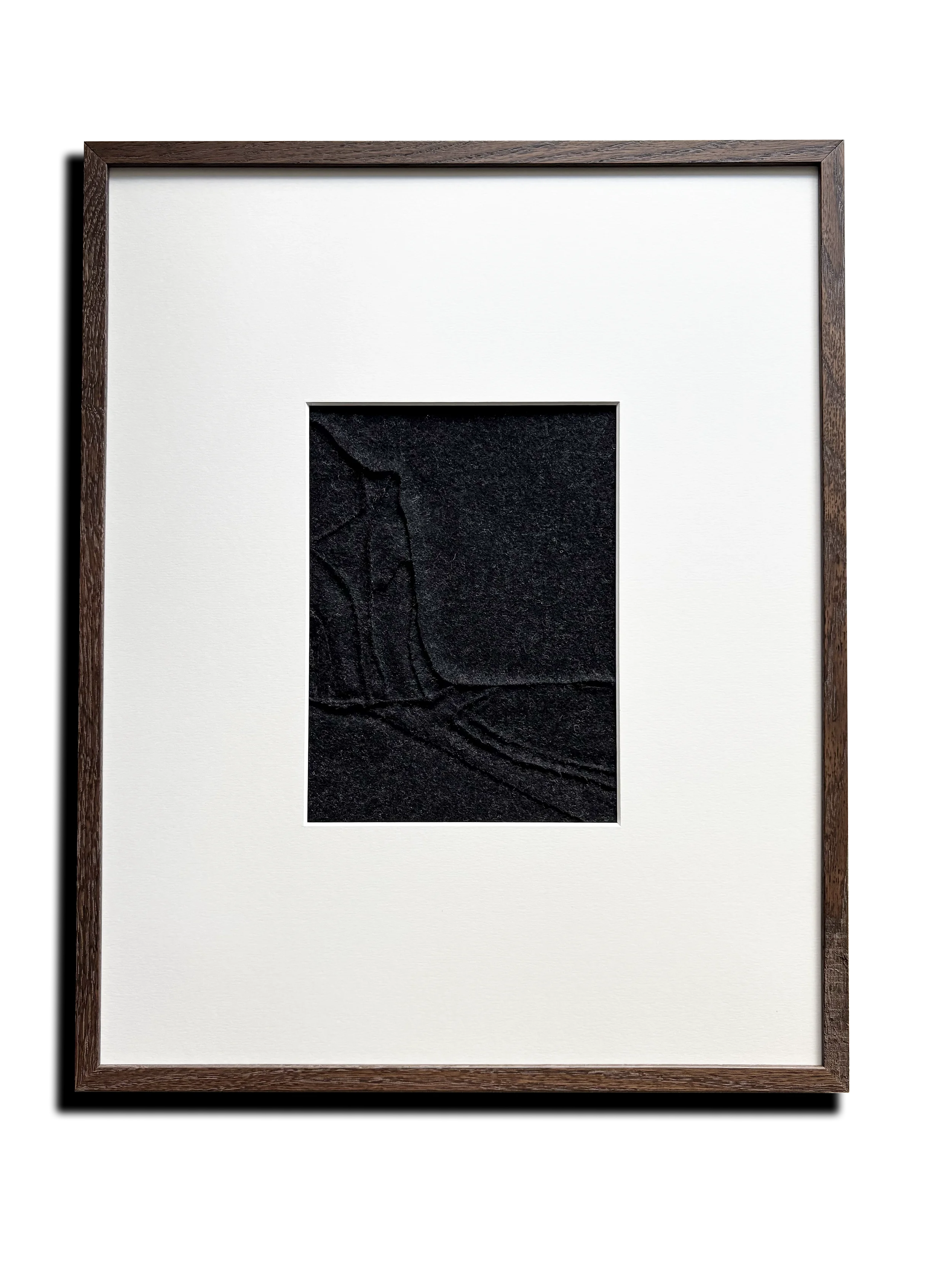 Hand sewn textile art created with 80% cashmere and 20% wool. Abstract landscape painting. Title: A Rocky Cliff. Color: anthracite. Framed in dark oak wood with passe-partout. 40x50 cm