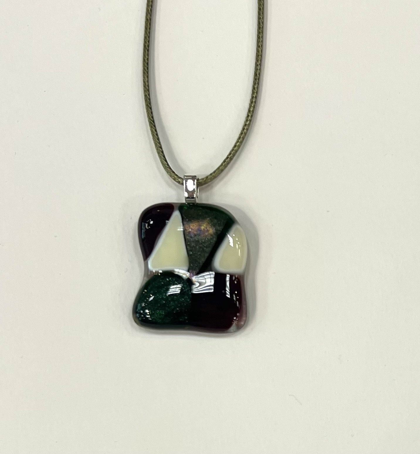 Camille Galli_Pendant with triangles_2025_Fused Glass_1x1.5_$25.jpeg