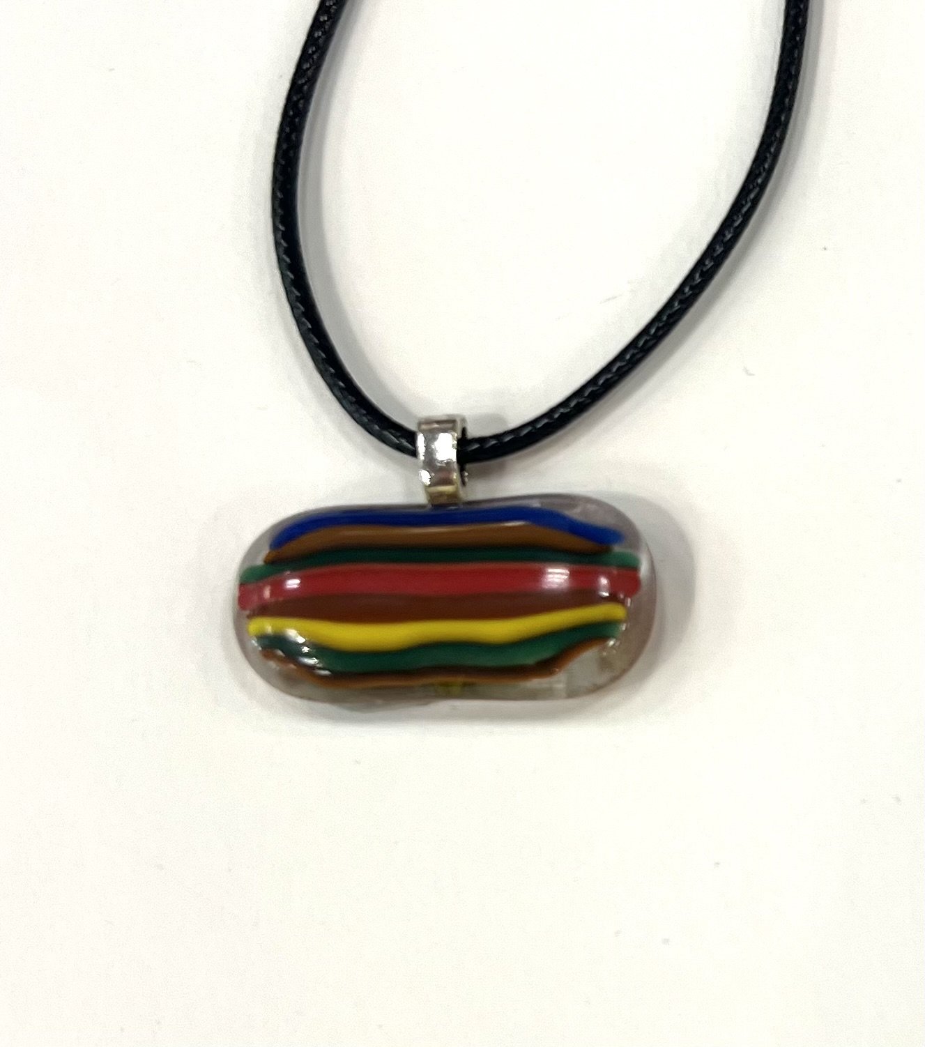 Camille Galli_pendant 1_2025_Fused Glass_1.25x.75_$20.jpeg
