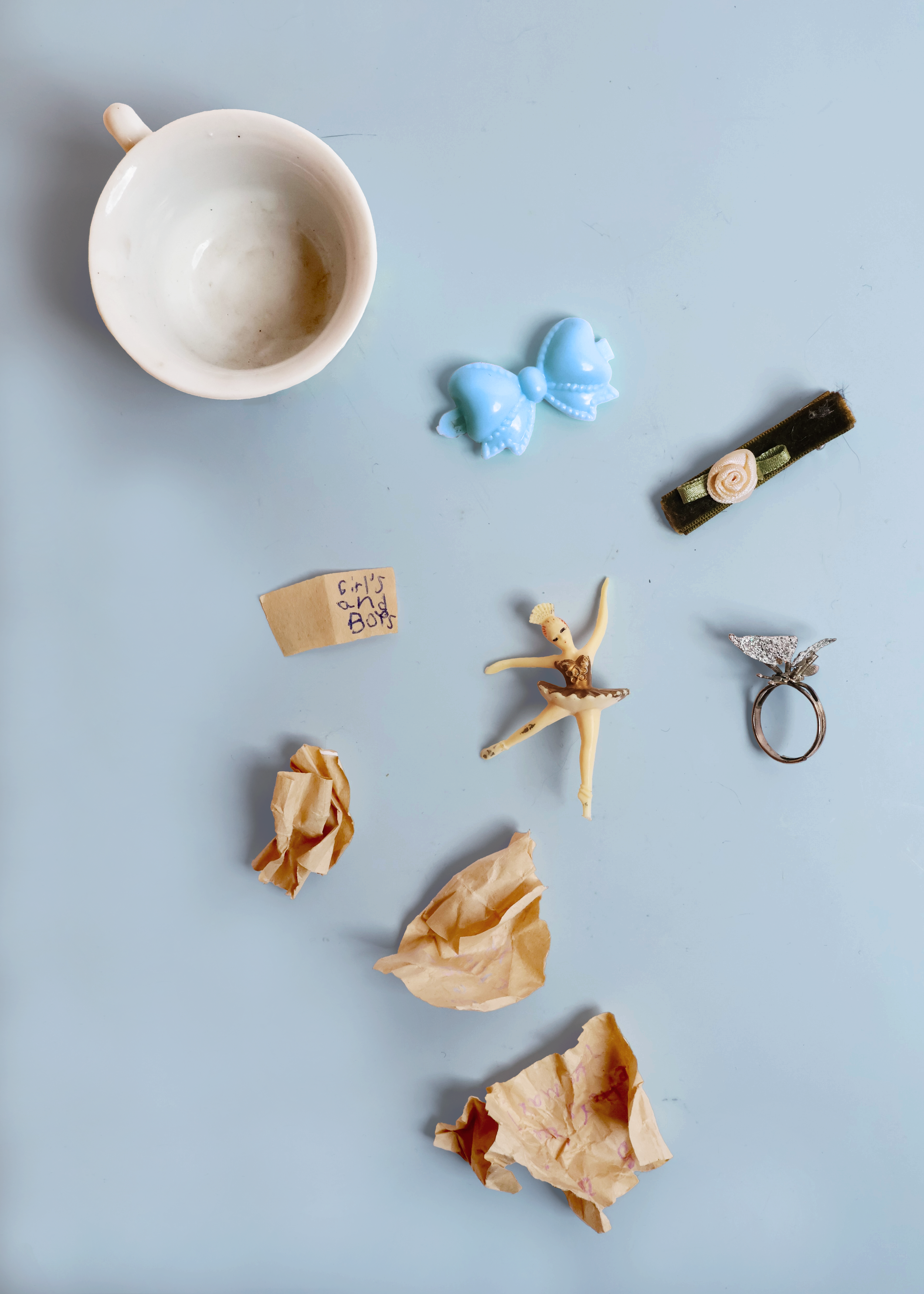 Girl’s and Boys (2001)
tea cup, plastic barrette, velvet barrette, pen on paper scrap, broken jewelry box ballerina figurine, glitter butterfly ring (a gift from my 1st grade boyfriend)