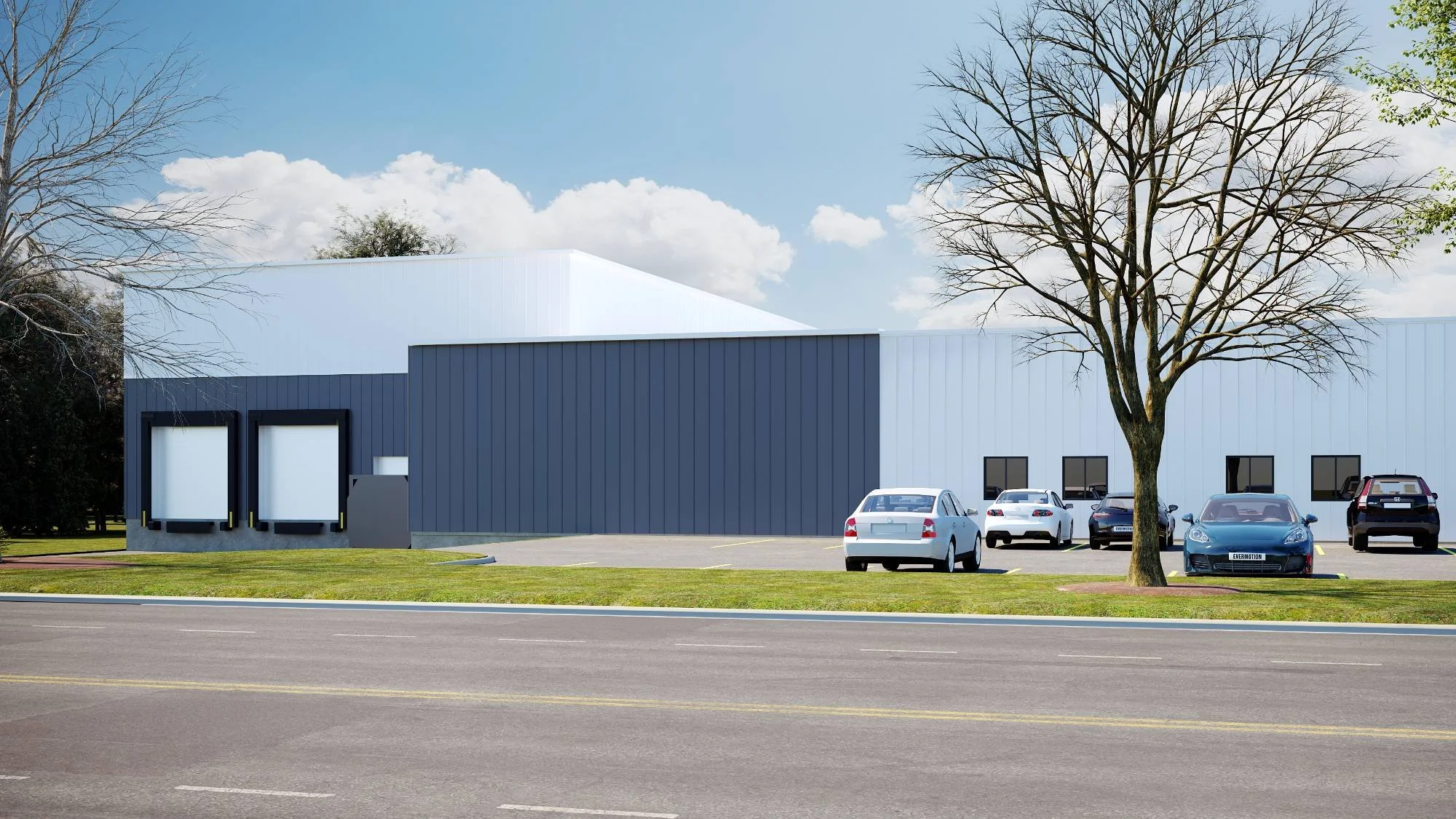 Modern commercial warehouse facility featuring sleek metal paneling, clean industrial lines, and an integrated office entry — commercial architecture by Lindsey Architects, serving Maine, New Hampshire, and Massachusetts.