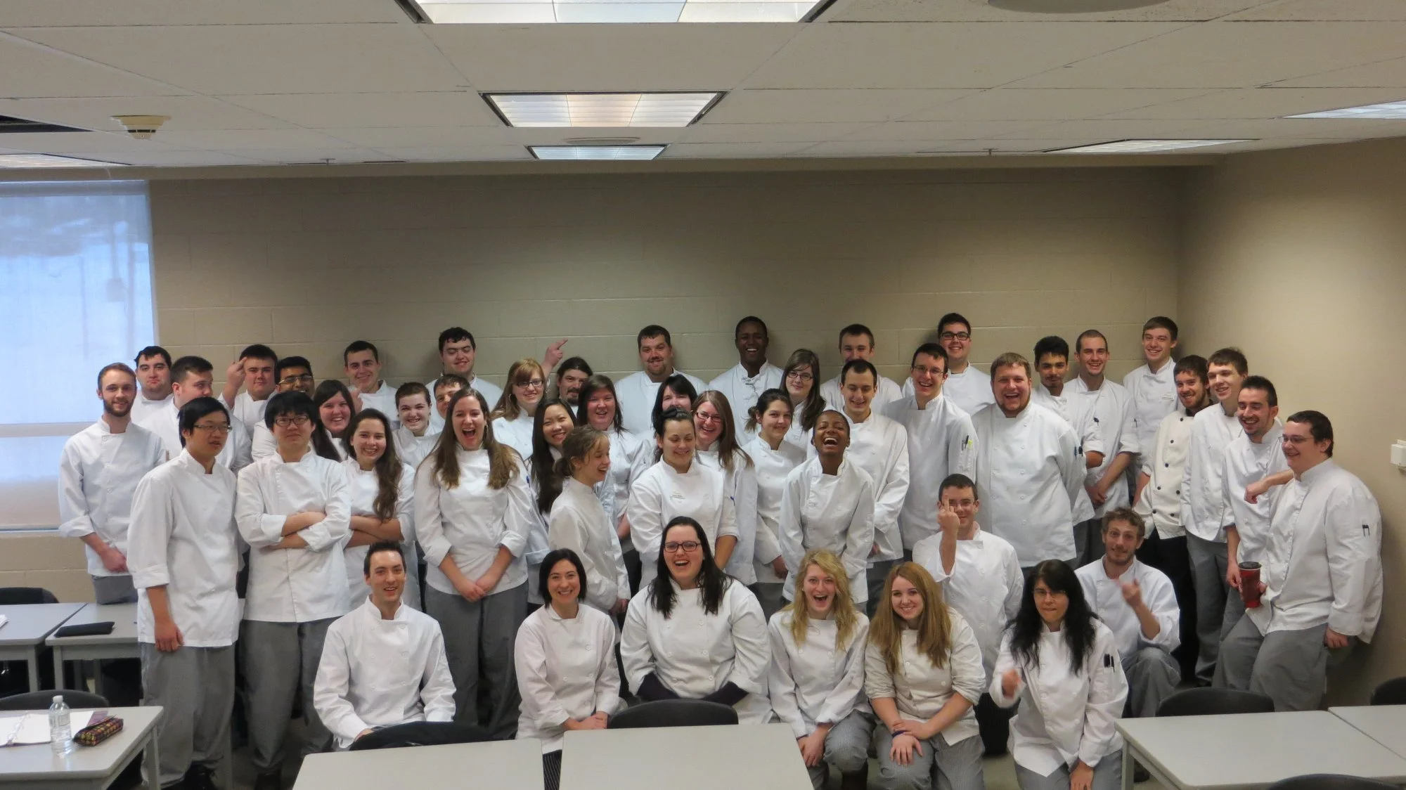 group of culinary school students in classroom