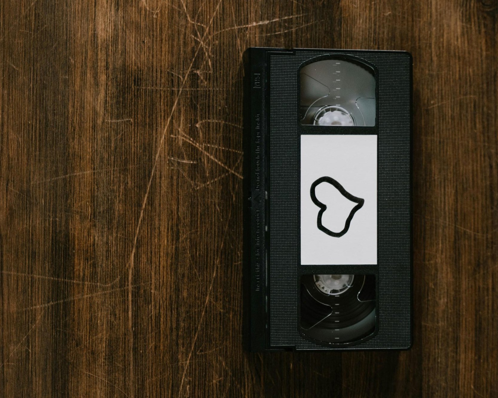 VHS tape with a handwritten heart note, a cherished memory ready to be digitized and preserved
