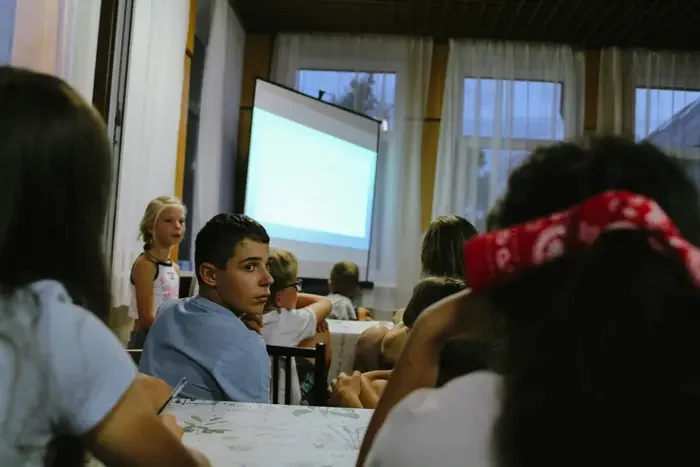 Student presenting at school, a graduation milestone worth preserving in a video slideshow