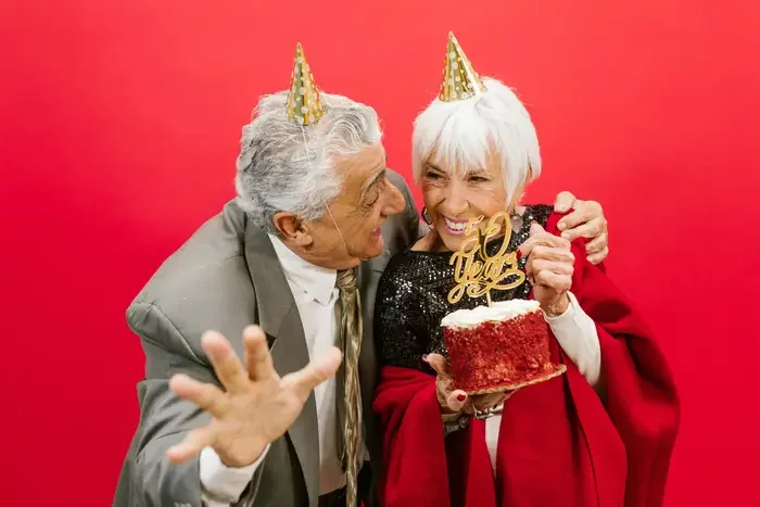 Elderly couple celebrating their 50th wedding anniversary, a milestone made even more special with a personalized anniversary video slideshow