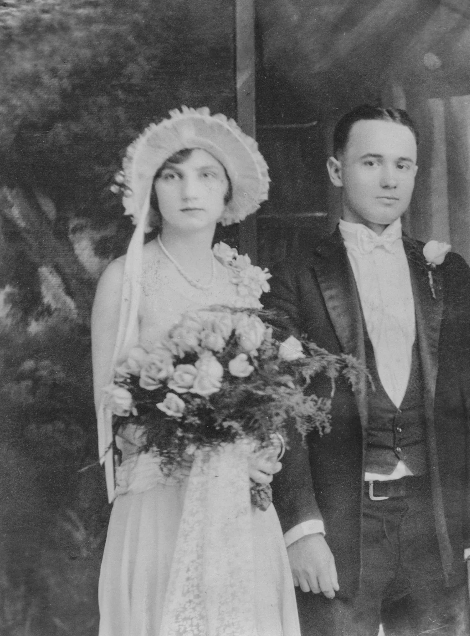 Black and white photograph of a bride and groom on their wedding day.