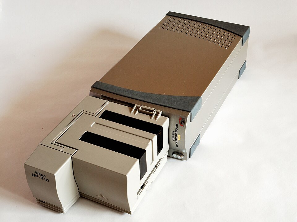 A vintage Nikon Super Coolscan 5000 ED film scanner with a tray for holding film slides or negatives.