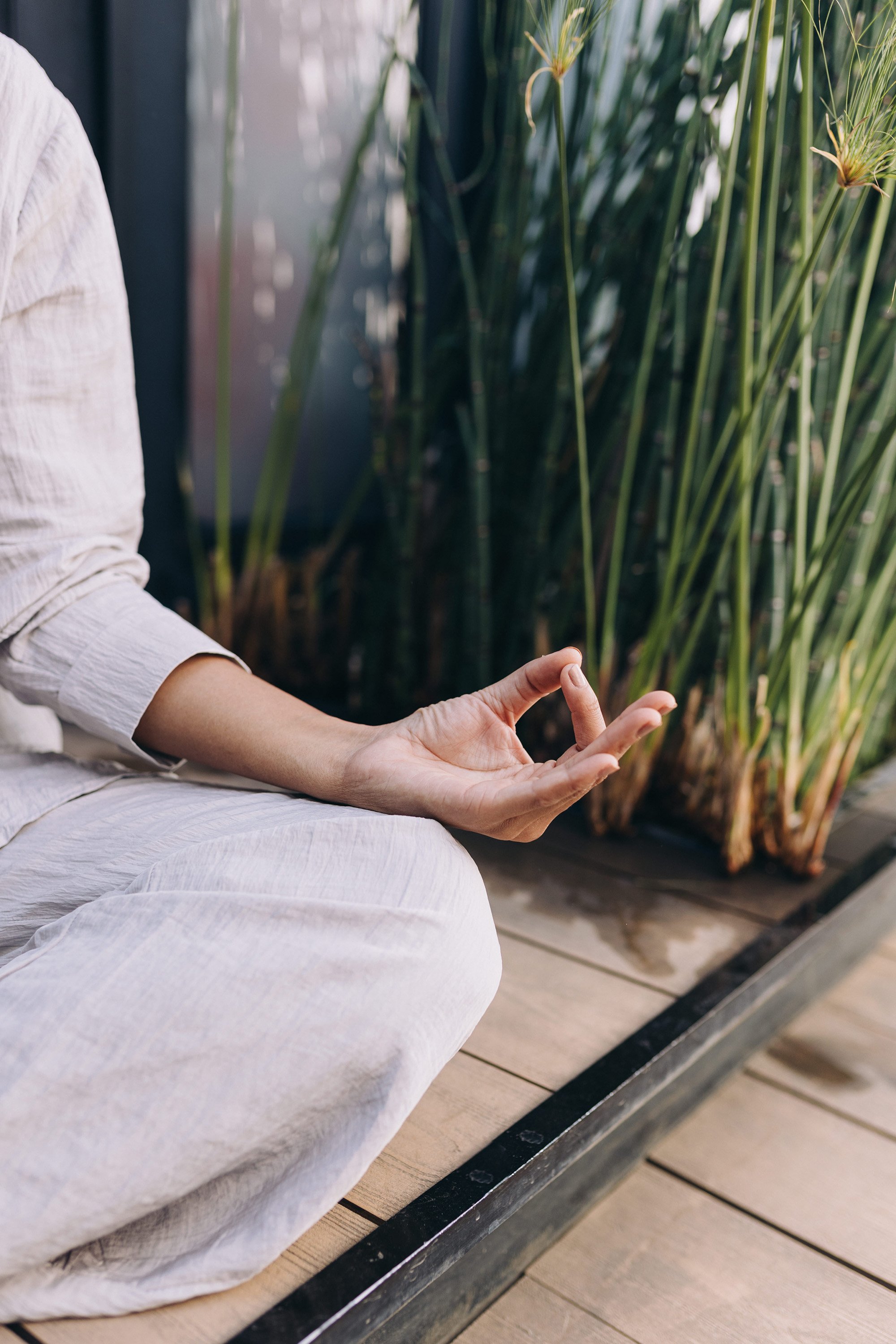 A woman in a sitting meditation position.