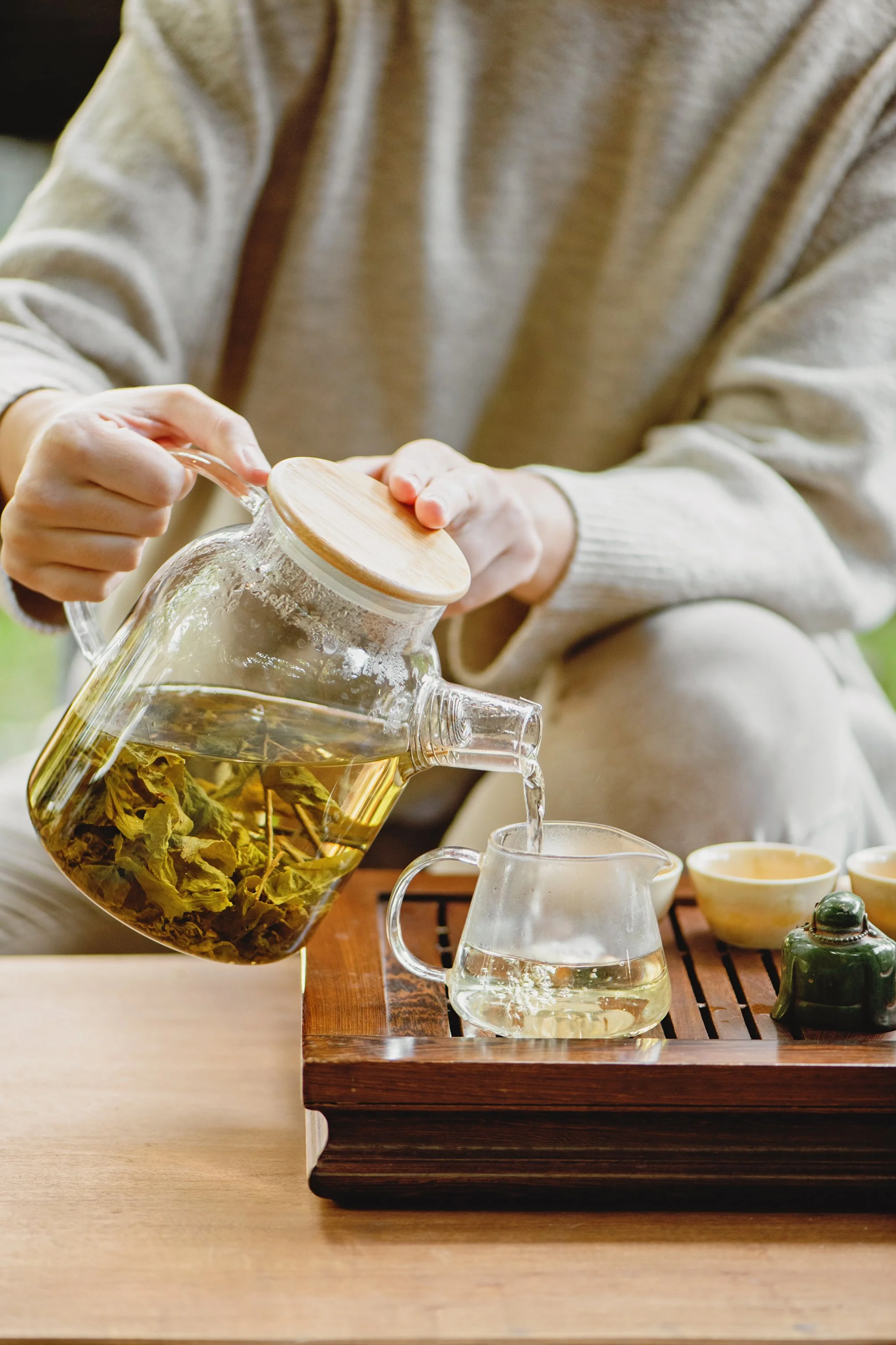 A woman pouring tea.