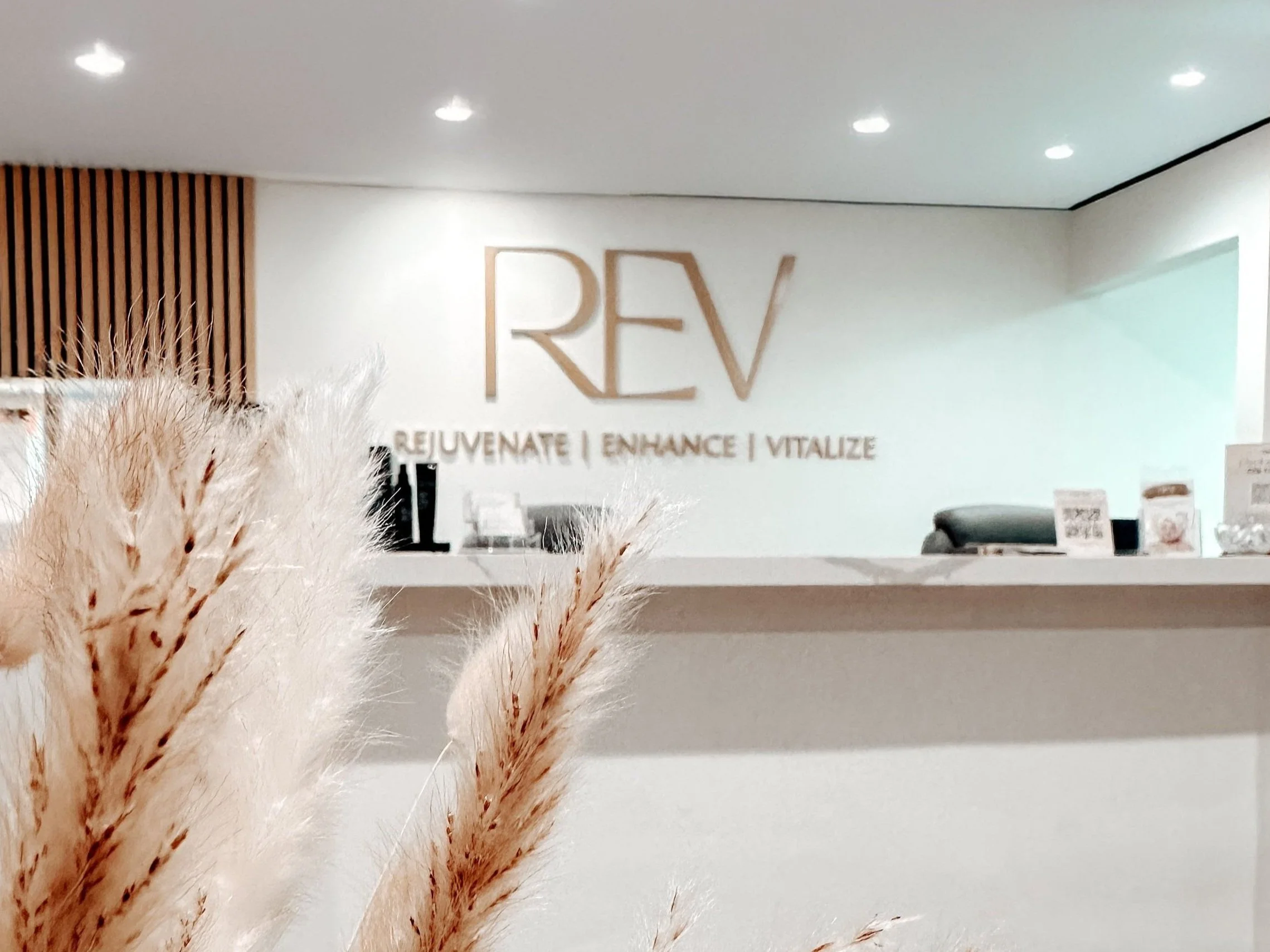 Clean, professional medical spa treatment room with neutral tones at REV Med Spa in Altamonte Springs