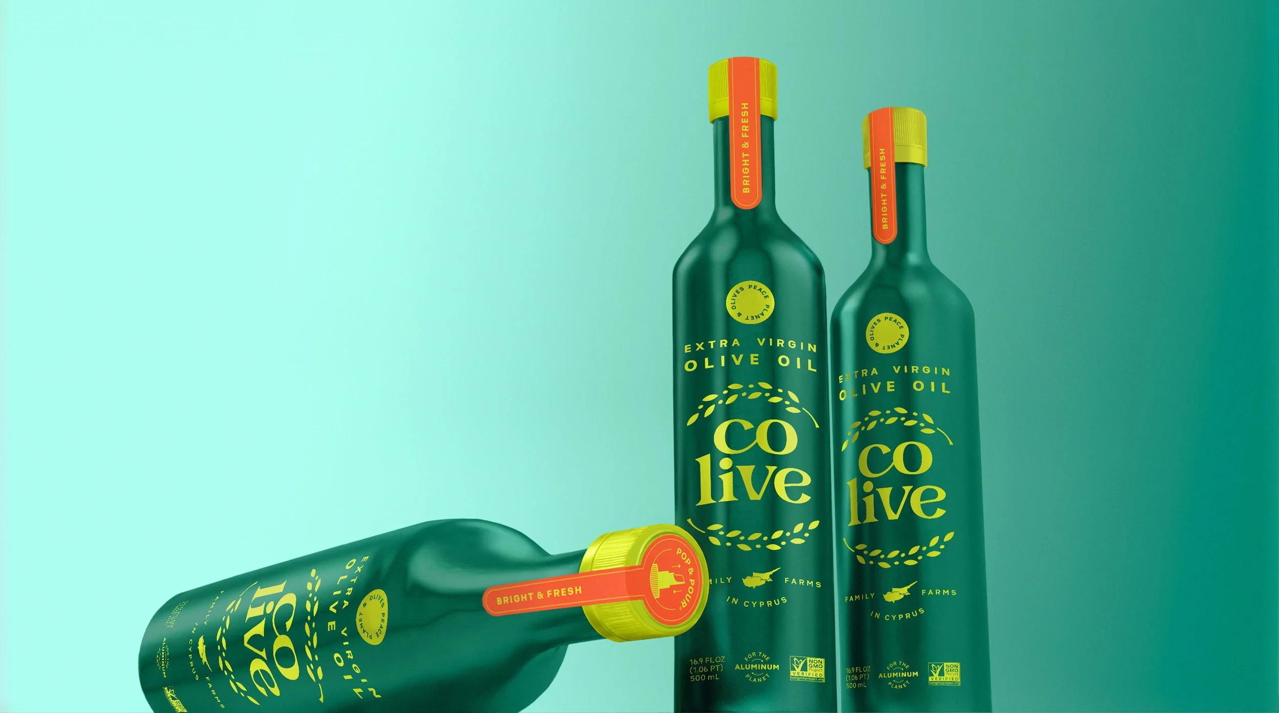 Three green bottles of Colive extra virgin olive oil on a teal background.