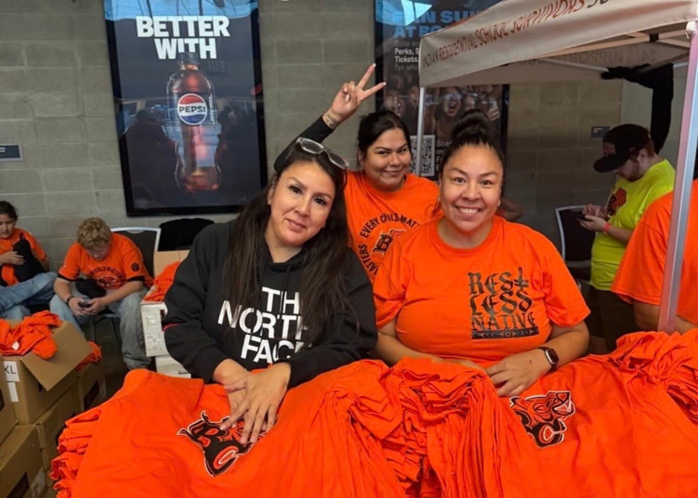  IRSSS staff at our BC Lions Orange Shirt booth 