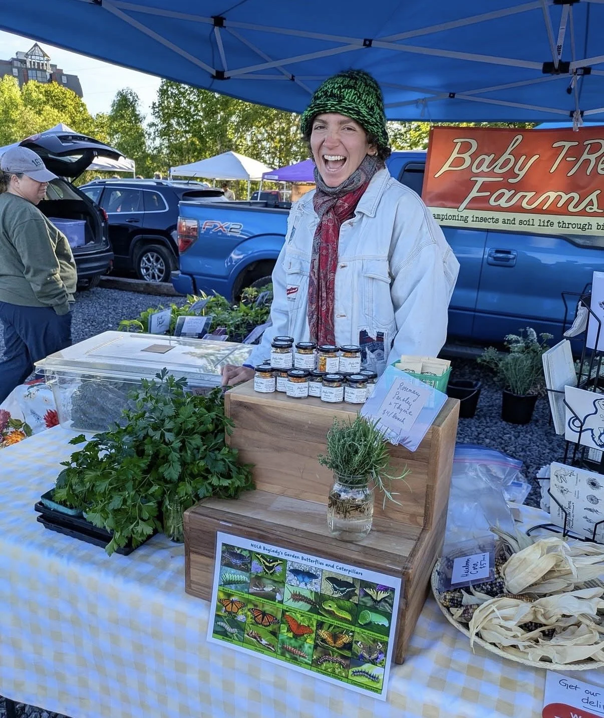 Farmer's market stands for Baby T-Rex Farm's flower bouquets.