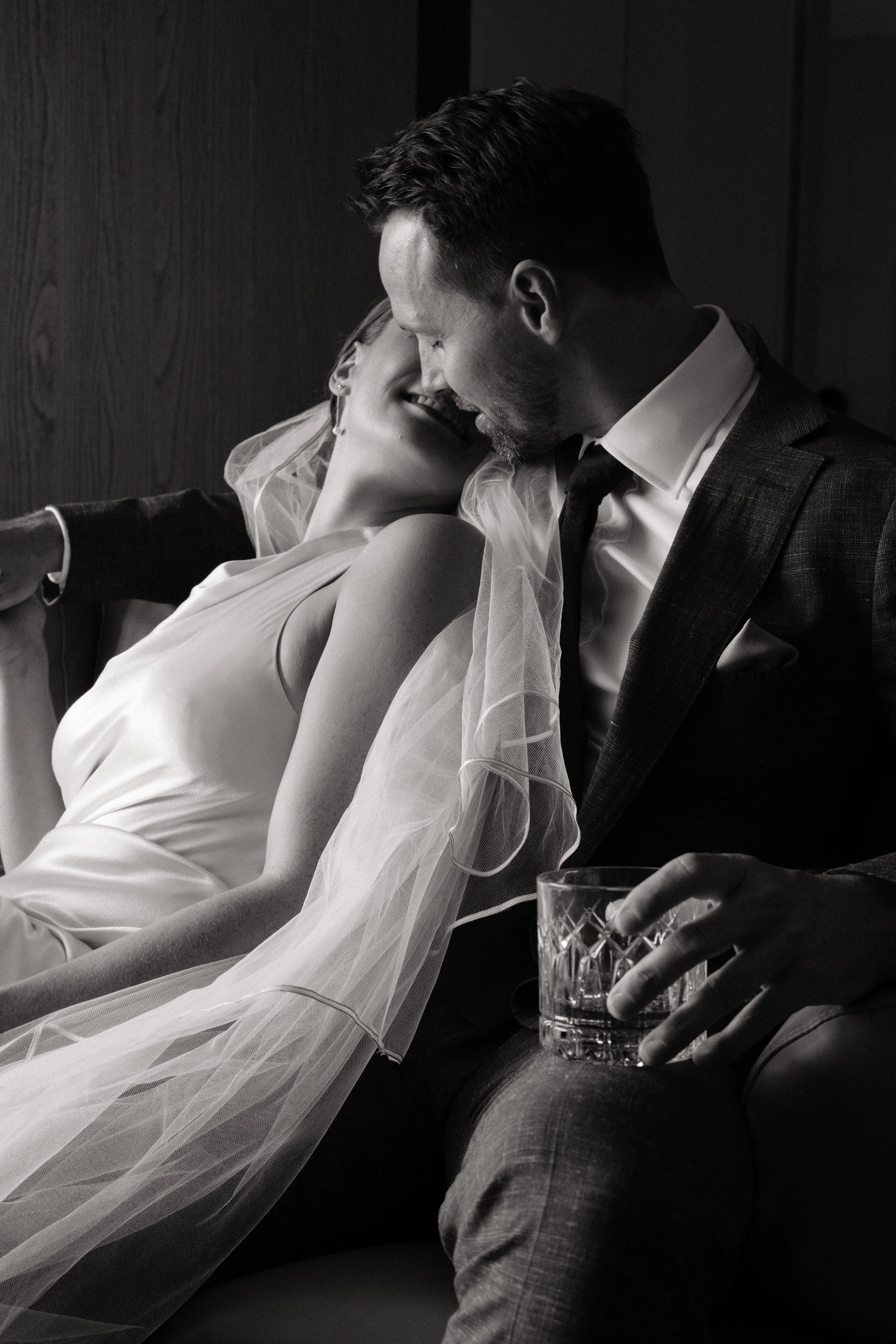 Bride and groom sharing an intimate first look at Hotel Indigo Adelaide Markets, captured by Woodley Photography. This candid moment showcases natural light and emotional connection, reflecting the essence of Adelaide wedding photography