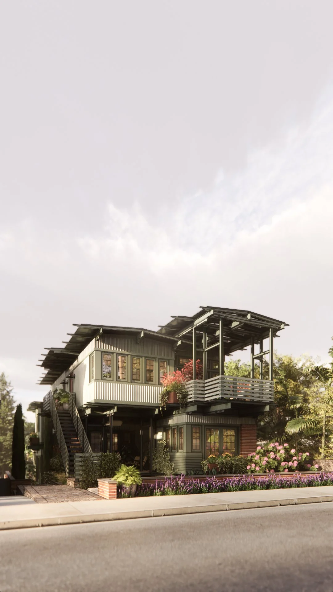 Modern multi-story house with large windows, a rooftop patio with a railing, surrounded by lush landscaping and flowering plants, under a cloudy sky.
