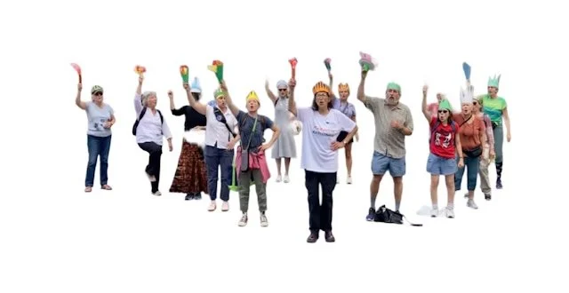 A flash mob of people of different genders and ages dressed as Lady Liberty and holding their torch high