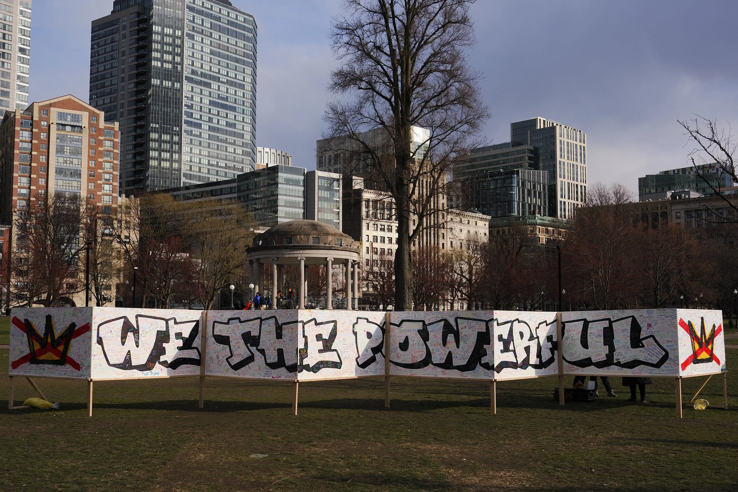 Mural that says "We the Powerful" with handwritten hopeful messages all over it at No Kings III in Boston by Mass 50501.