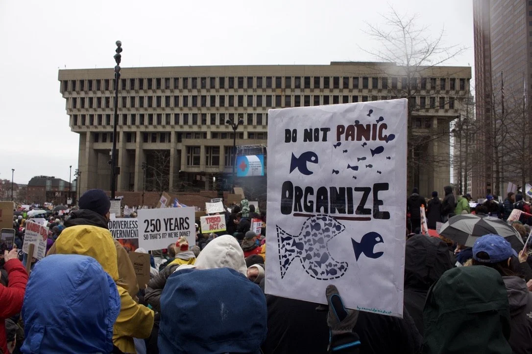 A Sign that says "Do Not Panic: Organize!"