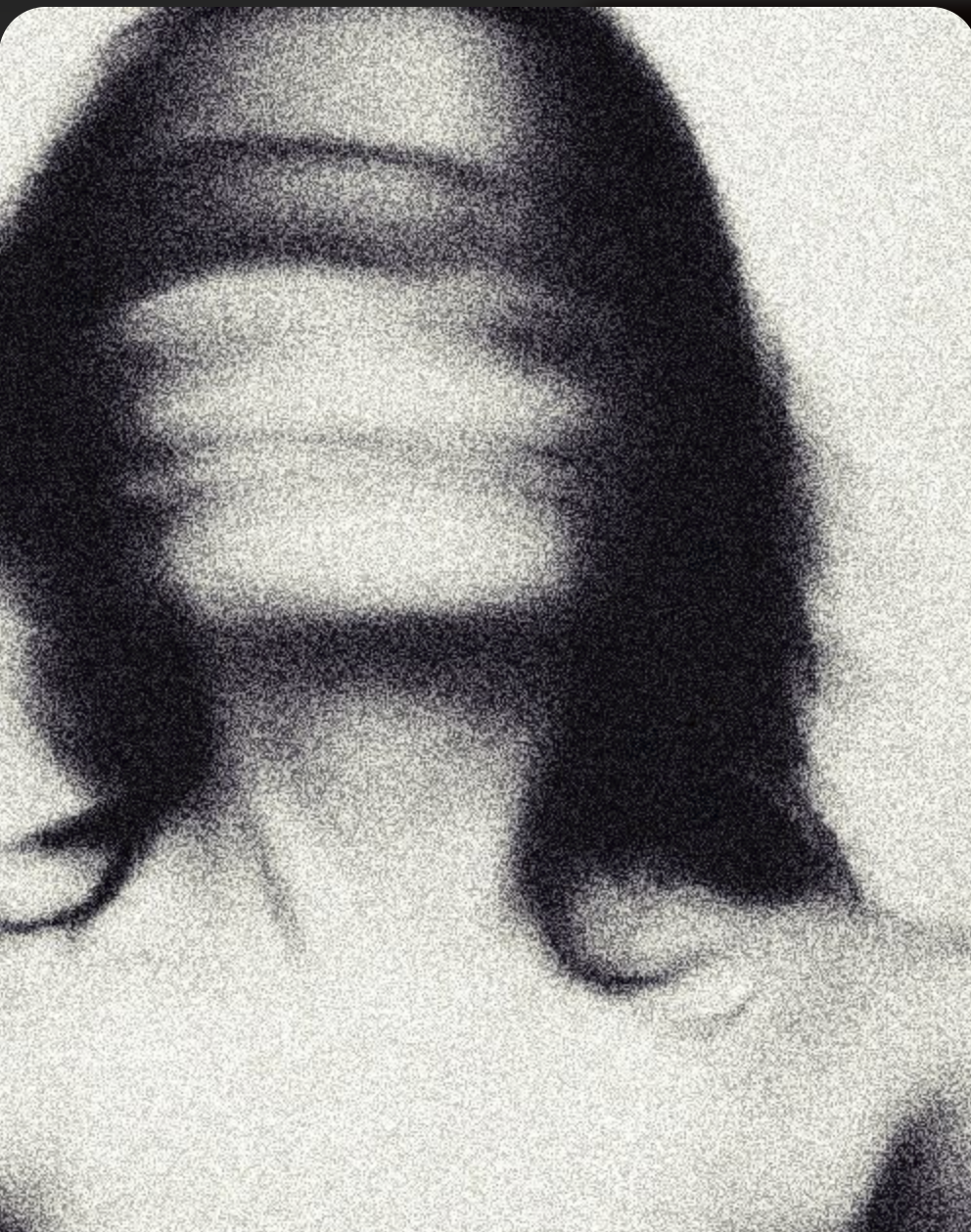 a blurred image of a woman in black and white that looks like she shook her head during a slow shutter speed. A creative image that is an interpretation of the word embodiment. 
